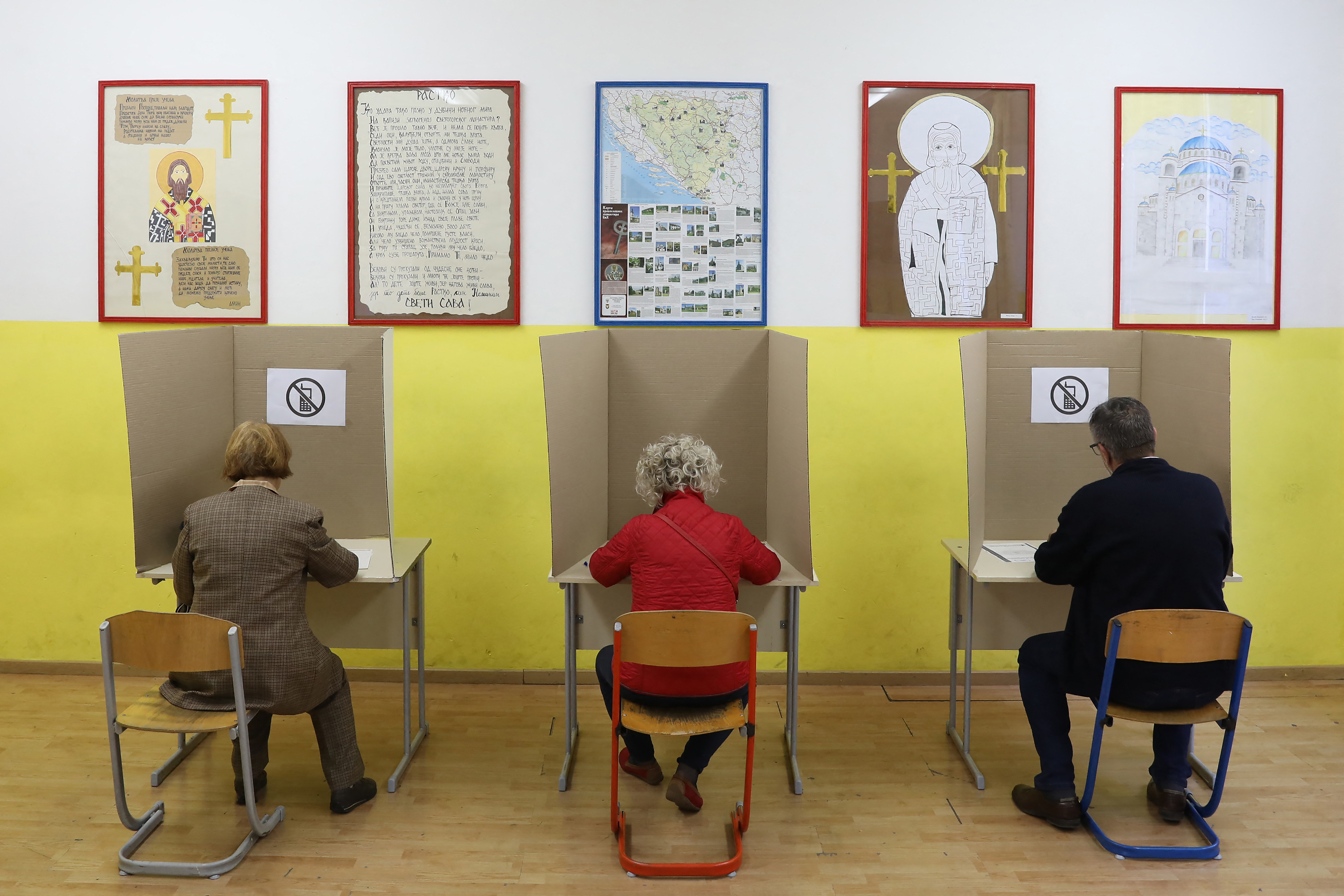 Voters fill their ballots at a polling station in Banja Luka. Bosnians headed to 
Milan Radulovic / AFP