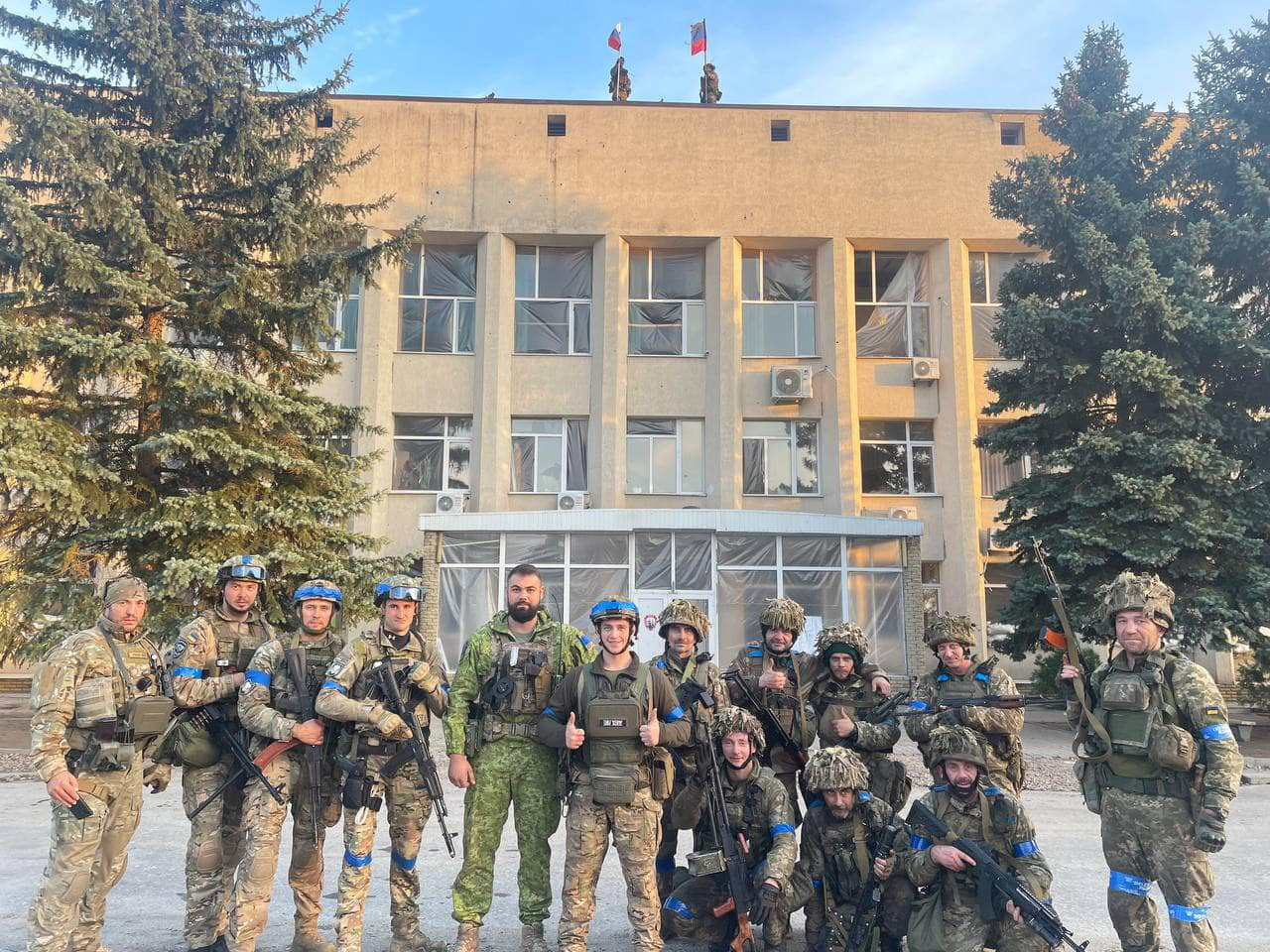 Ukrainian troops pose in Lyman for a photo released on social media. Oleksiy Biloshytskyi / Reuters