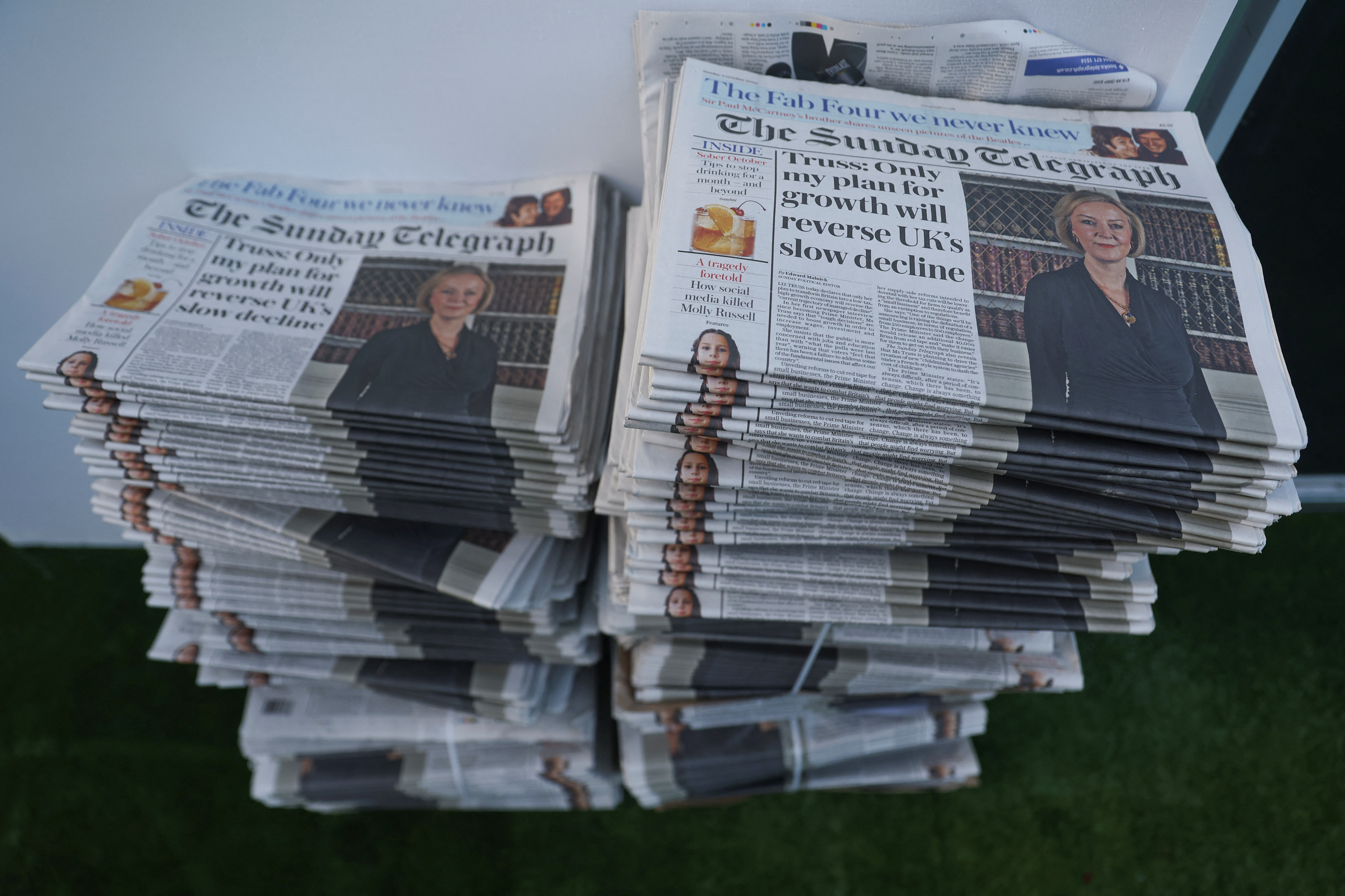 Copies of the generally Conservative-supporting Sunday Telegraph, featuring Liz Truss on the cover, are stacked, at the Conservative Party annual conference, in Birmingham. Reuters/Hannah McKay