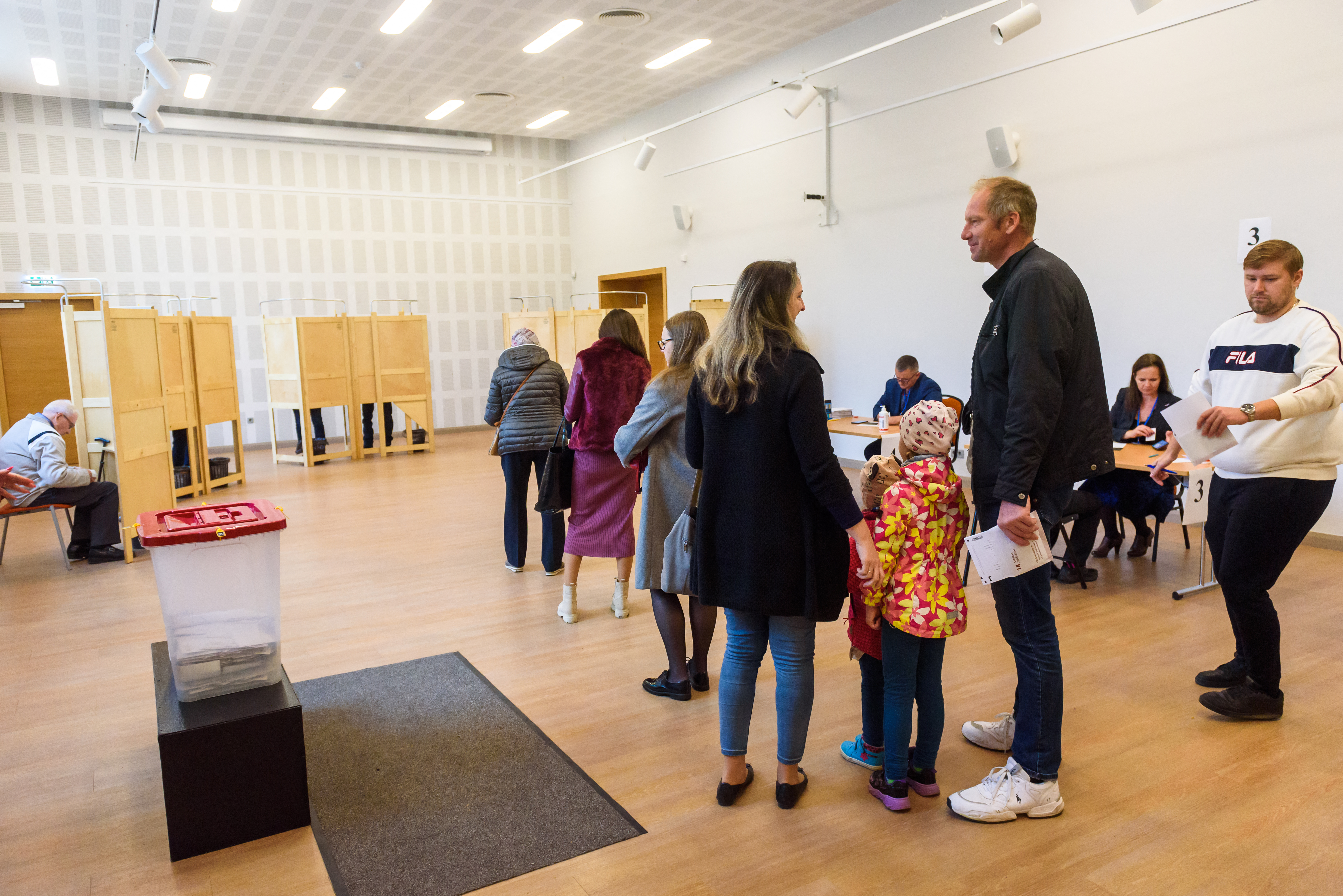 People vote at a polling station during the general election in Latvia which has been influenced by the Ukraine crisis. Gints Ivuskans/AFP