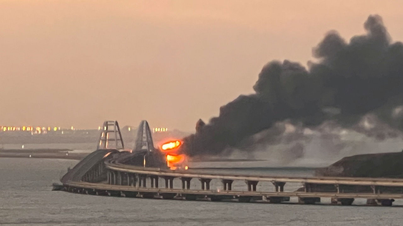 A view shows a fire on the Kerch bridge at sunrise in the Kerch Strait, Crimea, on October 8, 2022. /Stringer/Reuters