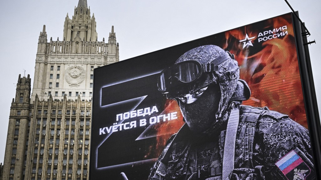 Russia's Foreign Ministry building behind an advertisement reading 'Victory is being Forged in Fire' in Moscow. /Alexander Nemenov/AFP