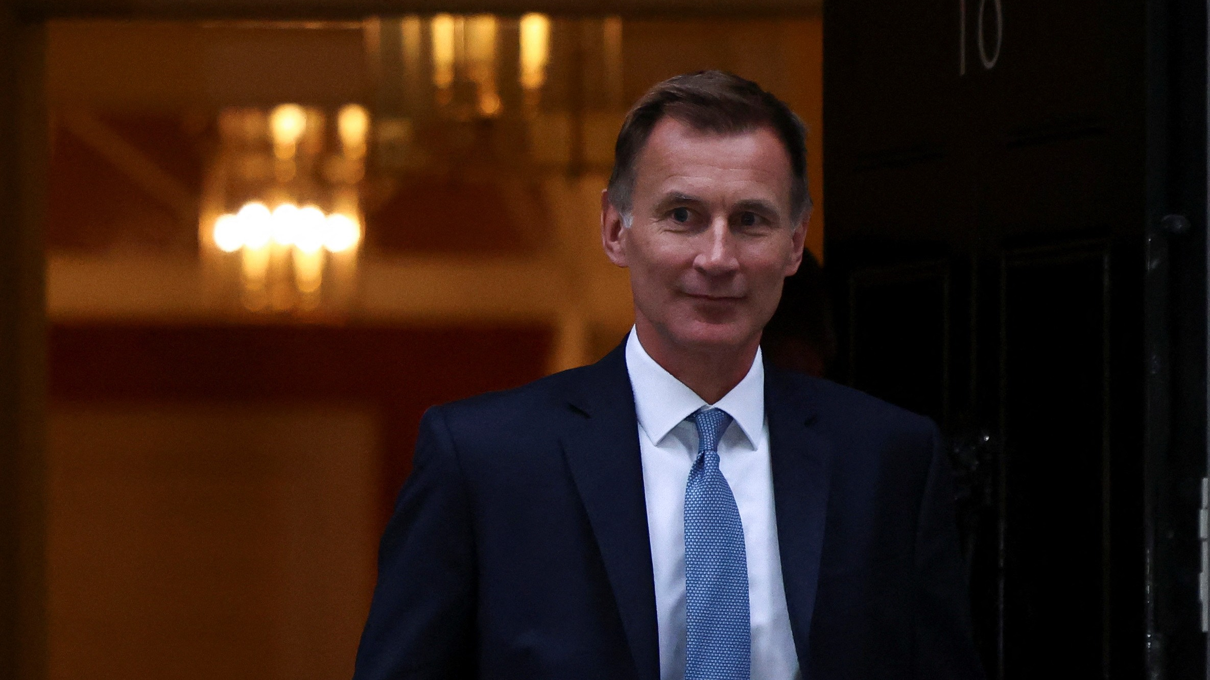 UK's new Chancellor of the Exchequer Jeremy Hunt leaves 10 Downing Street in London. /Henry Nicholls/Reuters