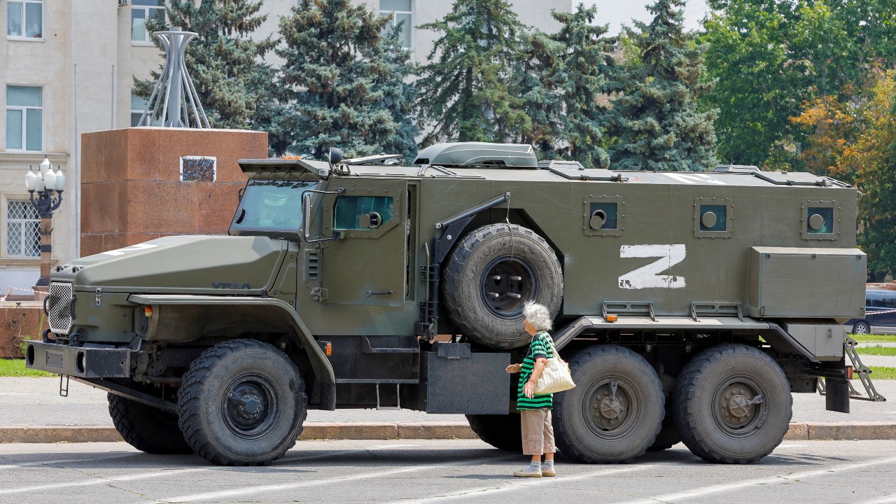 An armored truck of pro-Russian troops is parked near Ukraine's former regional council's building in the Russia-controlled city of Kherson, Ukraine. /Alexander Ermochenko/File Photo/Reuters