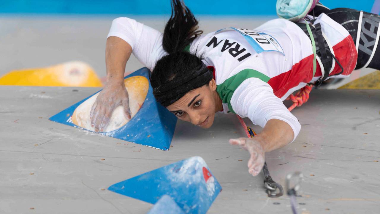 Rekabi competing during the women boulder finals without headscarf. /Rhea Kang/International Federation of Sport Climbing/AFP
