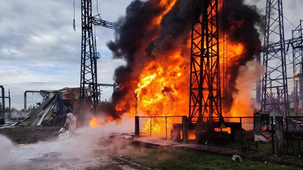 Firefighters work to put out a fire at energy infrastructure facilities, damaged by a Russian missile strike in an undisclosed location, Ukraine. /Ukrainian Presidential Press Service/Reuters