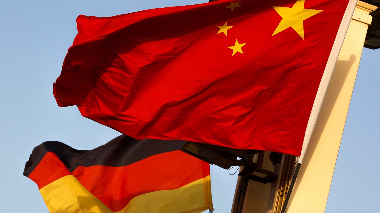 German and Chinese national flags flying in Tiananmen Square. /Thomas Peter/Reuters