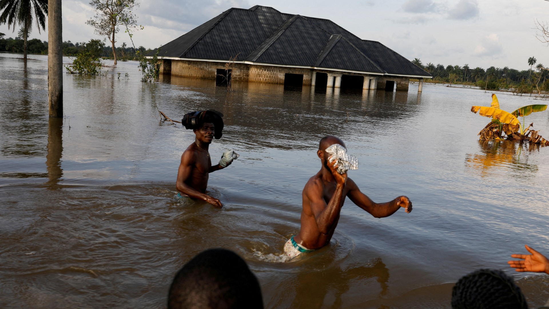 Flooding destroys lives and communities. /Temilade Adelaja/Reuters