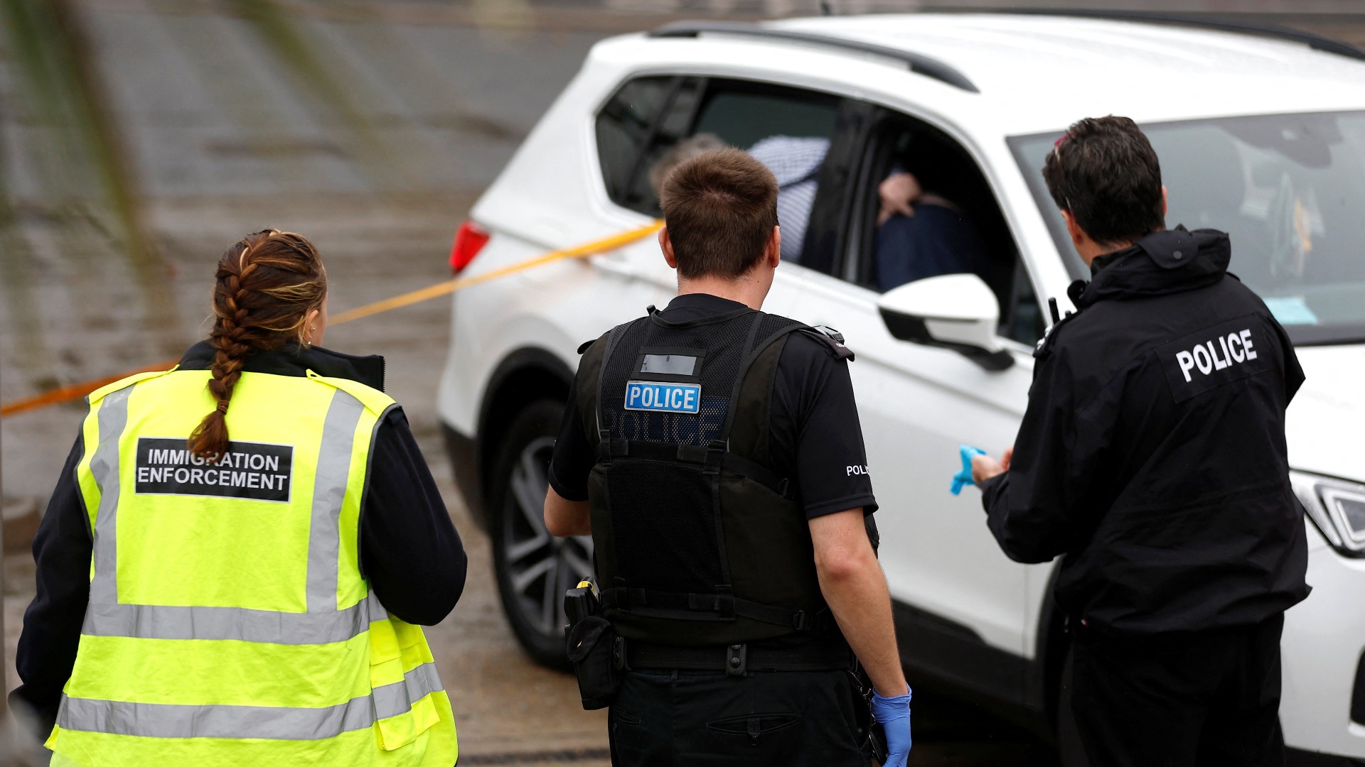 The devices were witnessed being thrown from a car at the Border Force processing center. /Peter Nicholls/Reuters