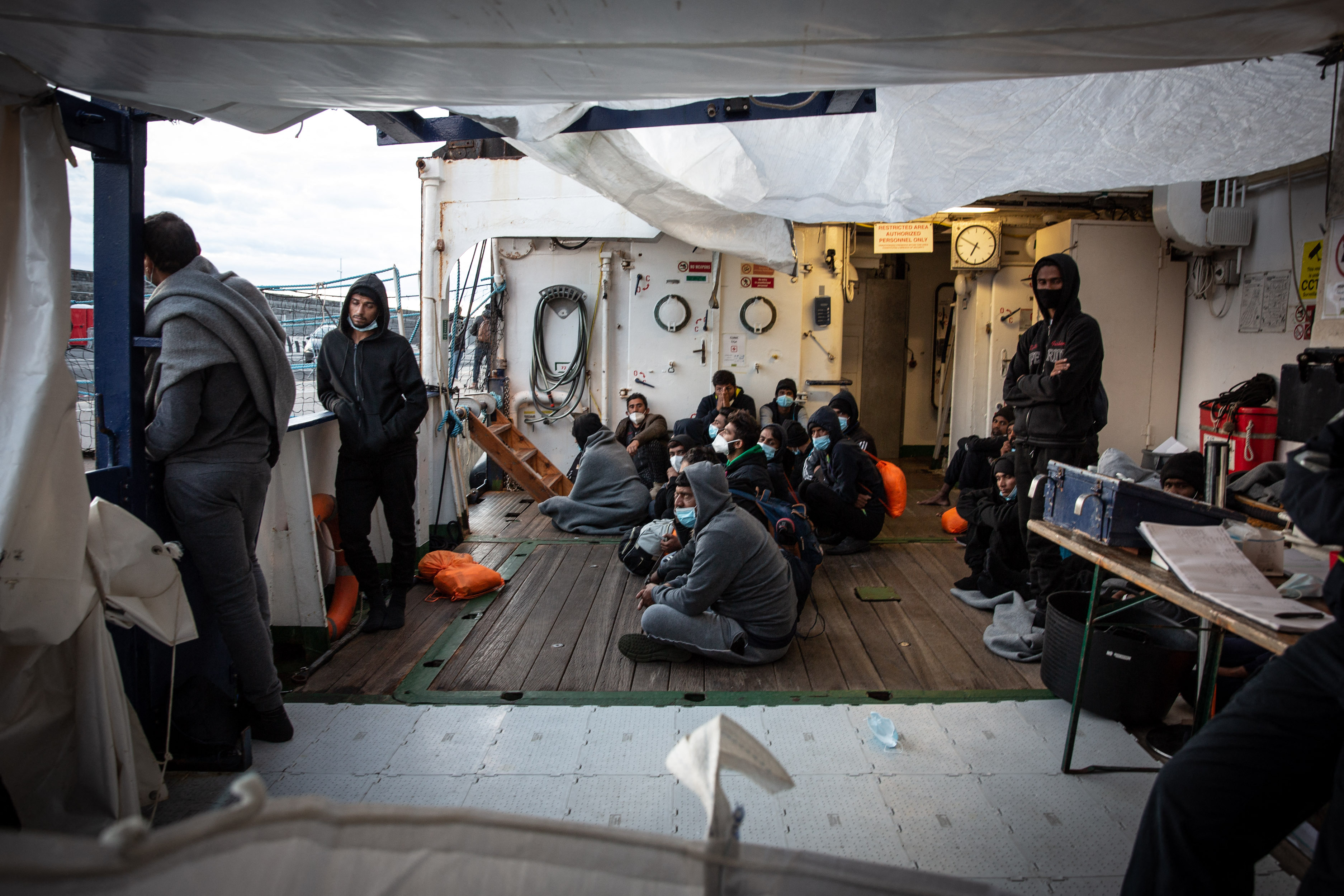 Migrants wait on board a rescue boat as they hope to land in Italy. Max Cavallari / SOS Humanity / AFP