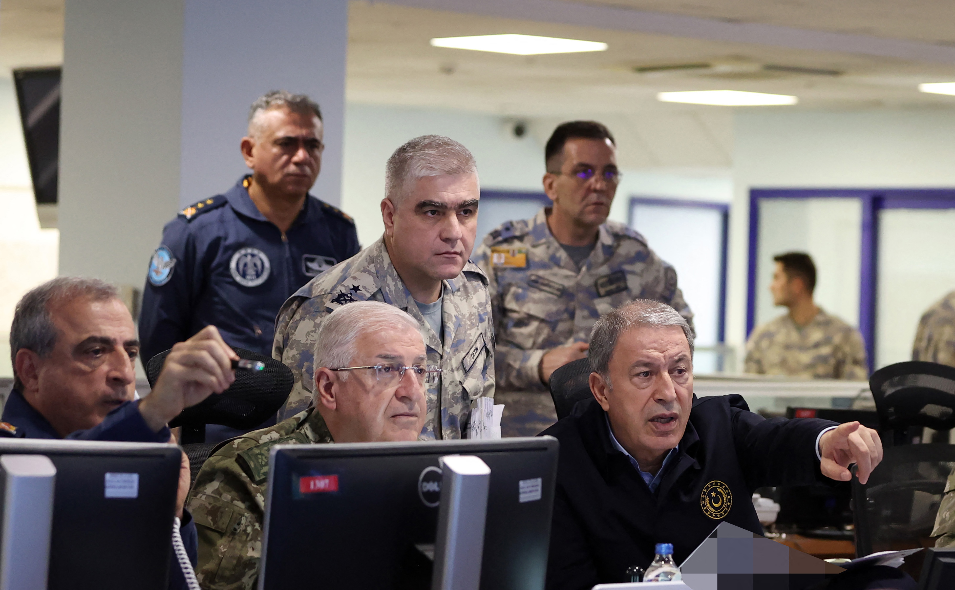 Türkiye's Defence Minister Hulusi Akar (R) chairs the air operation in northern regions of Iraq and Syria with commanders of the Turkish Armed Forces (TSK) at the Turkish Air Force Operations Centre in Ankara.
Press Office of the Ministry of National Defense of Türkiye / AFP