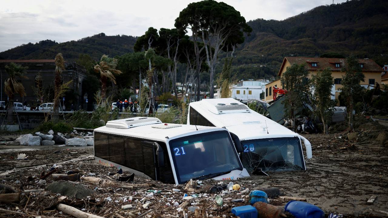Damaged buses lie amongst debris following a landslide on the Italian holiday island of Ischia. /Guglielmo Mangiapane/Reuters