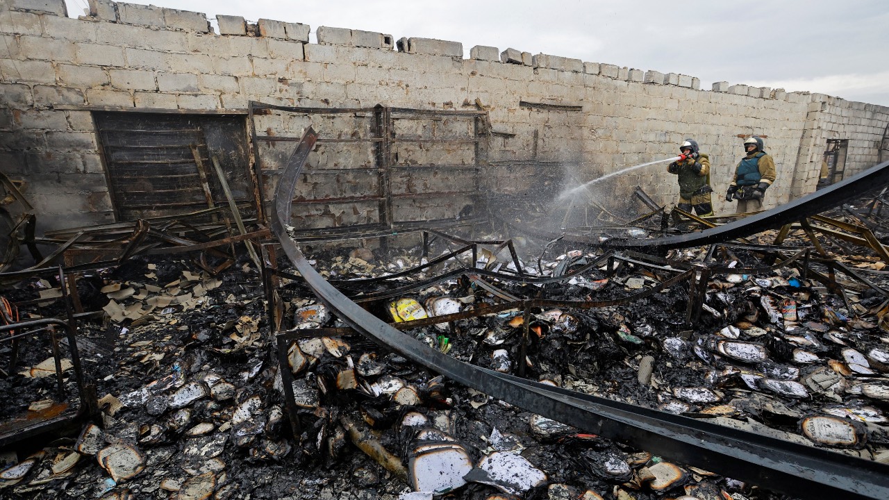 Firefighters work at a local market hit by shelling in Donetsk. /Alexander Ermochenko/Reuters