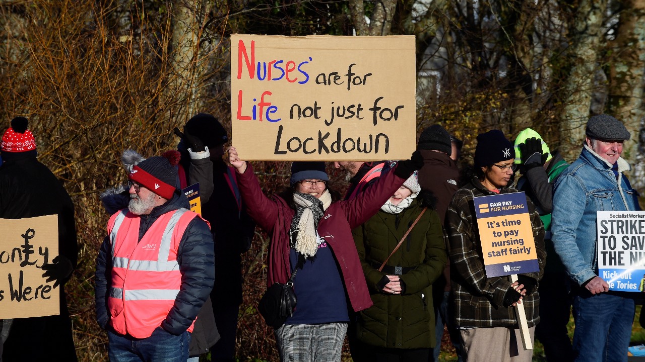 NHS nurses hold placards during a strike outside Withybush Hospital in Haverfordwest. /Rebecca Naden/Reuters
