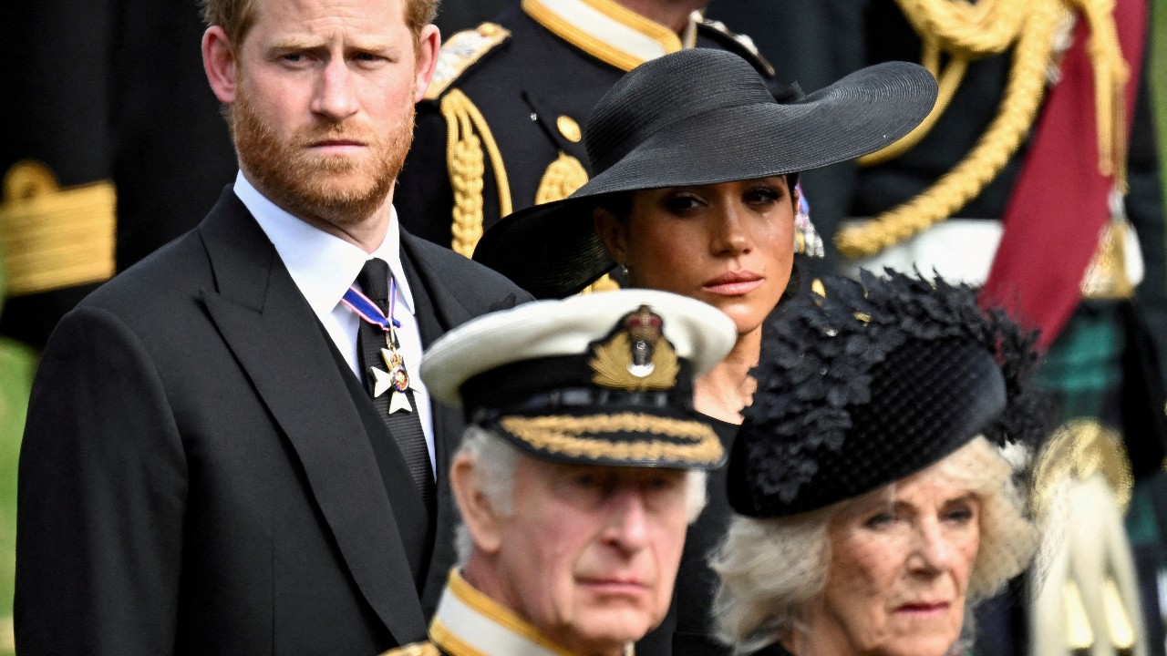 Meghan, Duchess of Sussex, cries as she, Prince Harry, Duke of Sussex, Queen Camilla and King Charles attend the state funeral and burial of Britain's Queen Elizabeth. /Toby Melville/Reuters