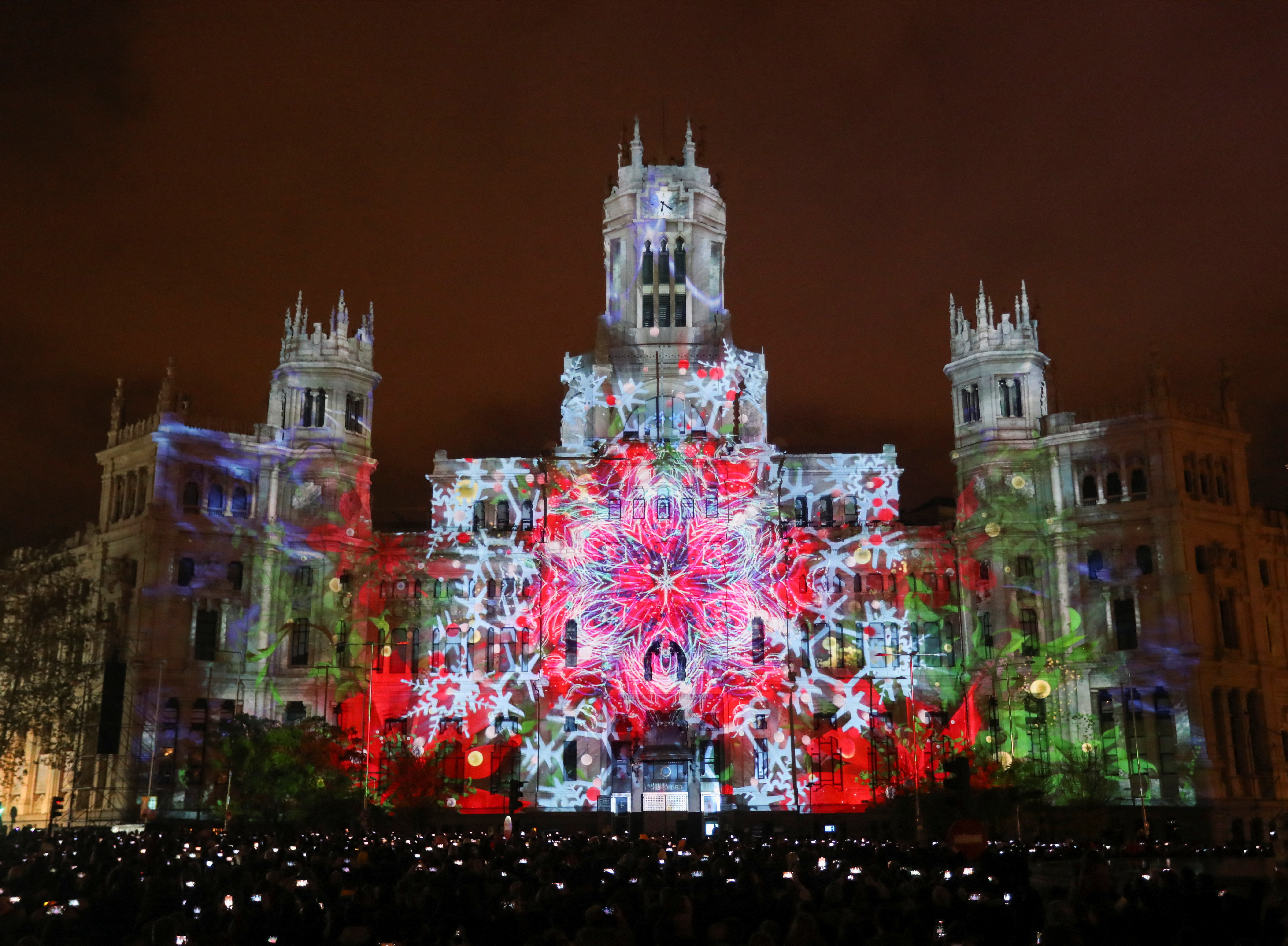 The Cibeles Palace, headquarters of the Madrid City Council, illuminated with Christmas lights, in Madrid, Spain, December 17, 2022. Image credit: Isabel Infantes via Reuters