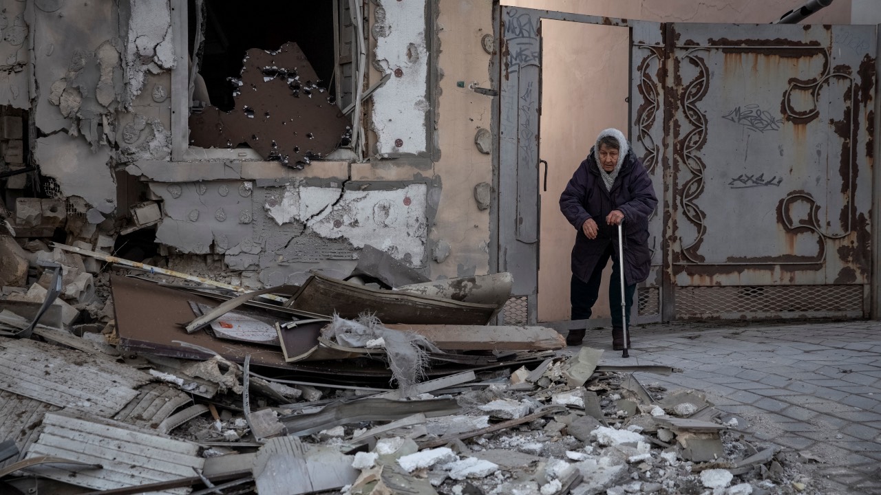A local resident stands in her house which was destroyed by a Russian military strike in Kherson. /Oleksandr Ratushniak/Reuters