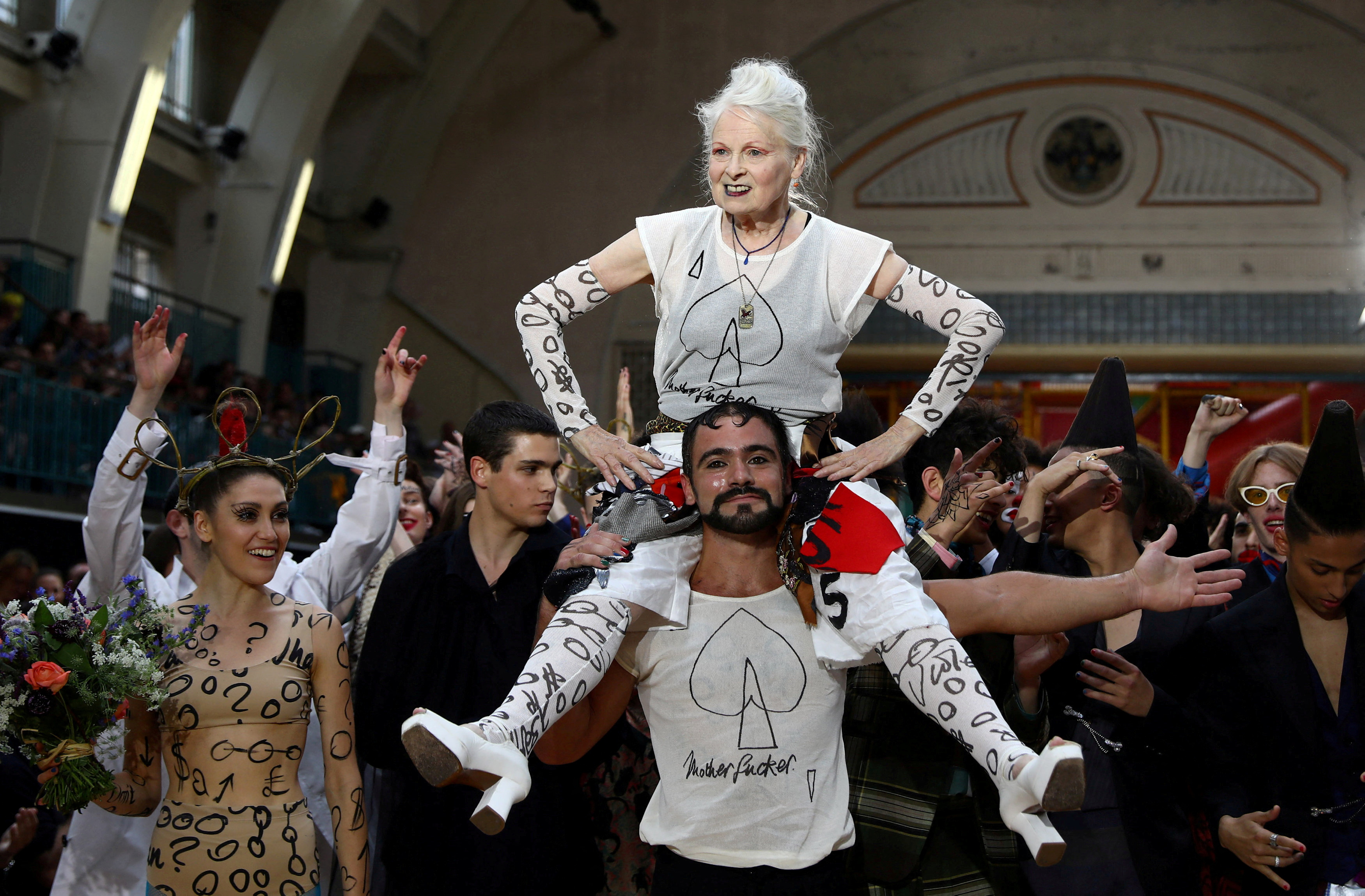 Designer Vivienne Westwood is carried after her catwalk show at London Fashion Week Men's in London, Britain June 12, 2017. Reuters/Neil Hall/File Photo