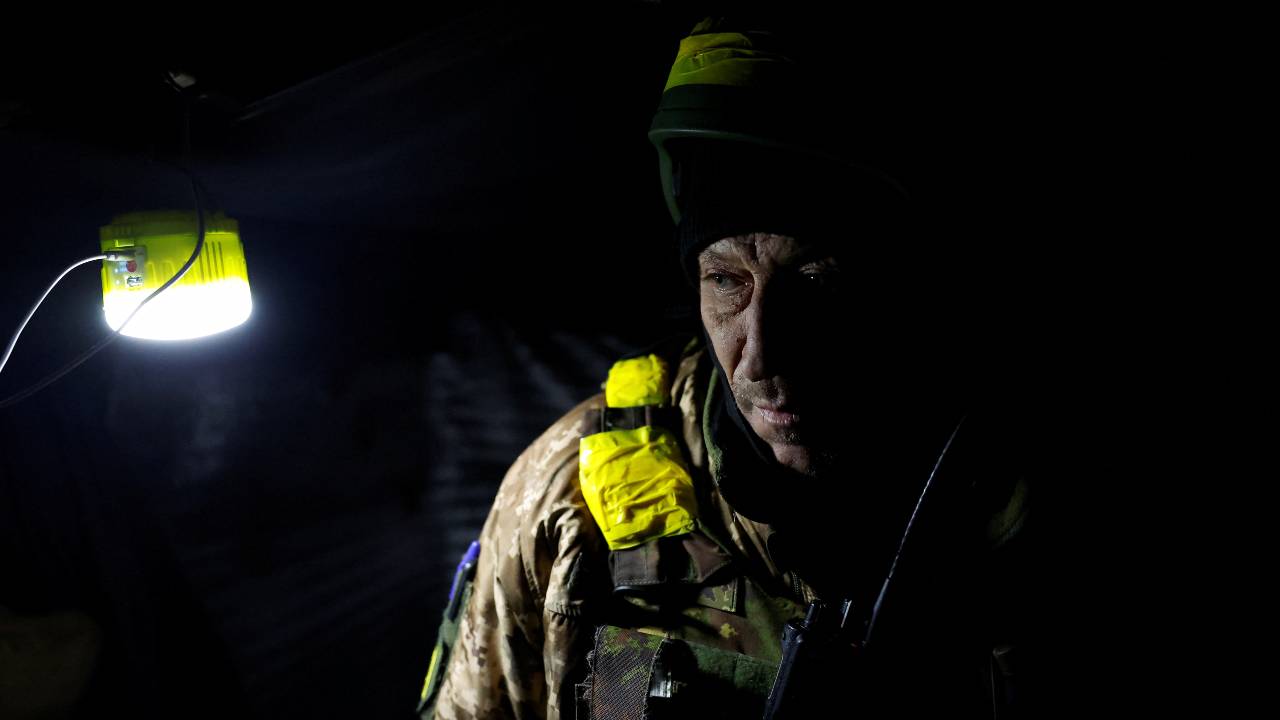 A Ukrainian soldier rests in an underground bunker in the region of Donetsk. /Clodagh Kilcoyne/Reuters