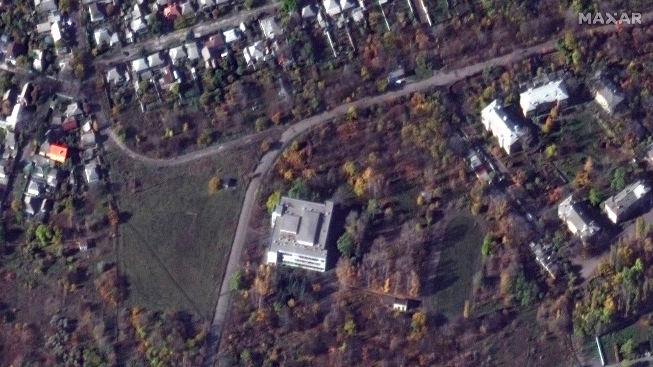 Satellite image shows buildings, among them a school that was used to house mobilized Russian troops, before they were hit in a strike in Makiivka, Russian-controlled Ukraine. /Maxar Technologies/Reuters
