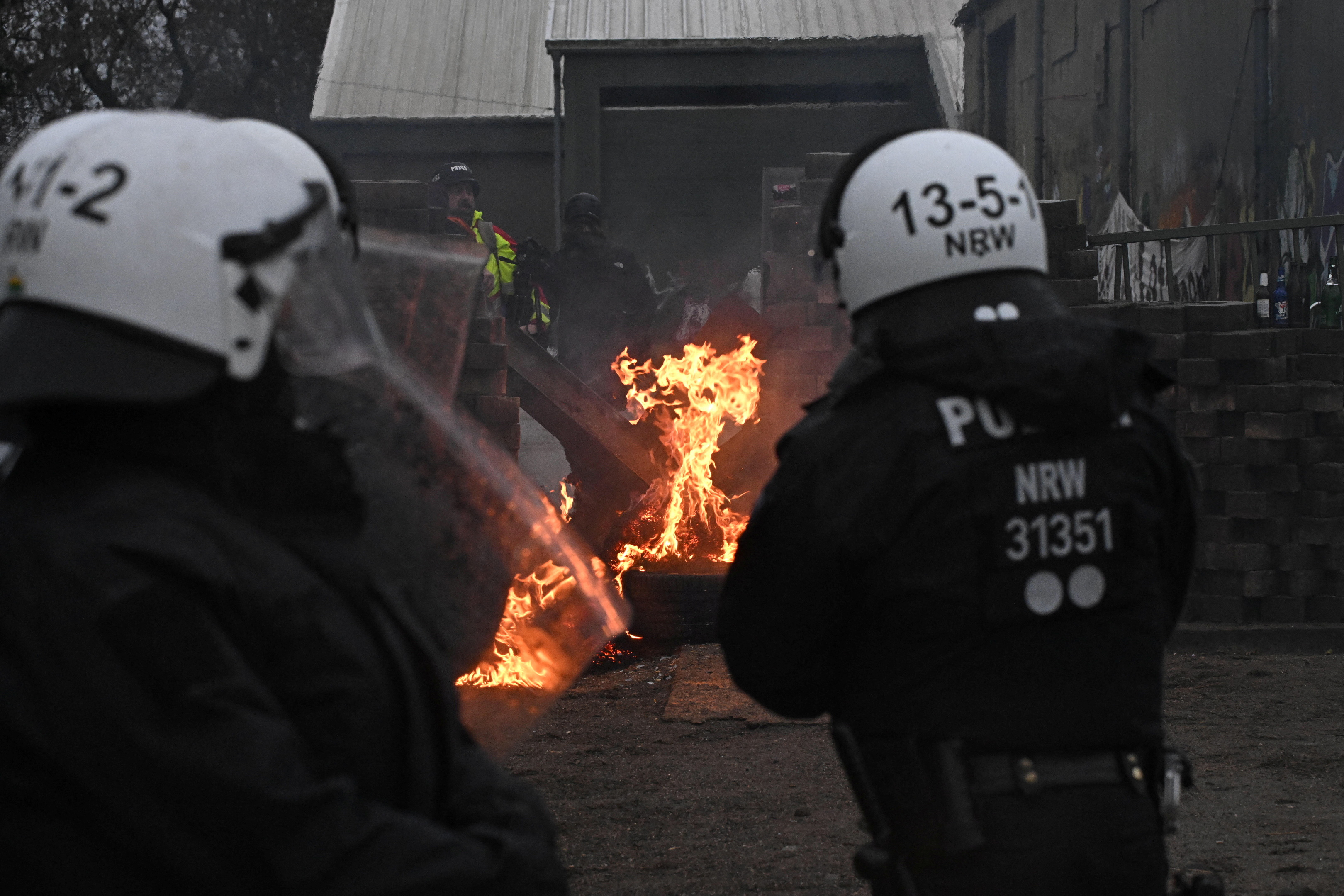 Demonstrators set tires on fire during the protest on Wednesday. /Benjamin Westhoff/Reuters
