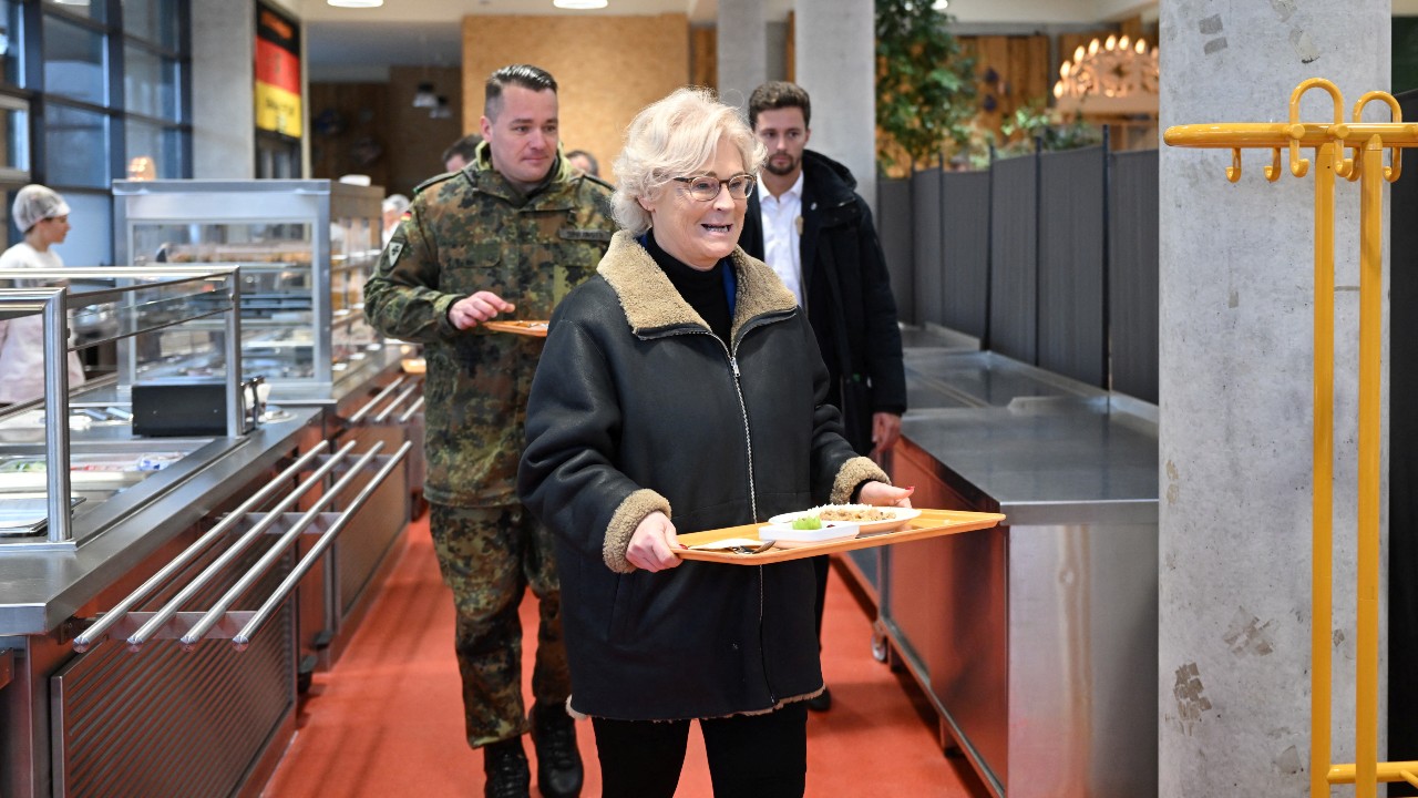 German Defense Minister Christine Lambrecht – seen here in an army canteen – had been widely criticized. /Robert Michael/Pool via Reuters