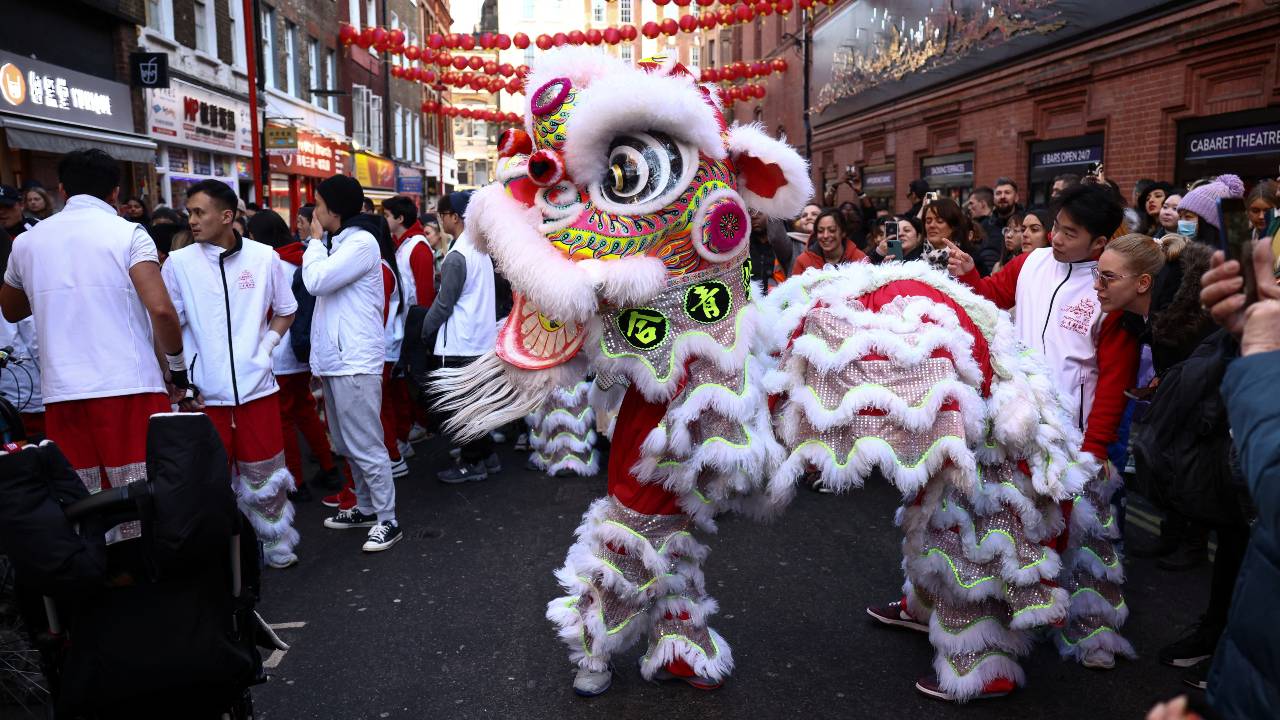 A Chinese lion dance is performed in Chinatown during Lunar New Year celebrations in London, Britain, January 21, 2023. /Henry Nicholls/Reuters