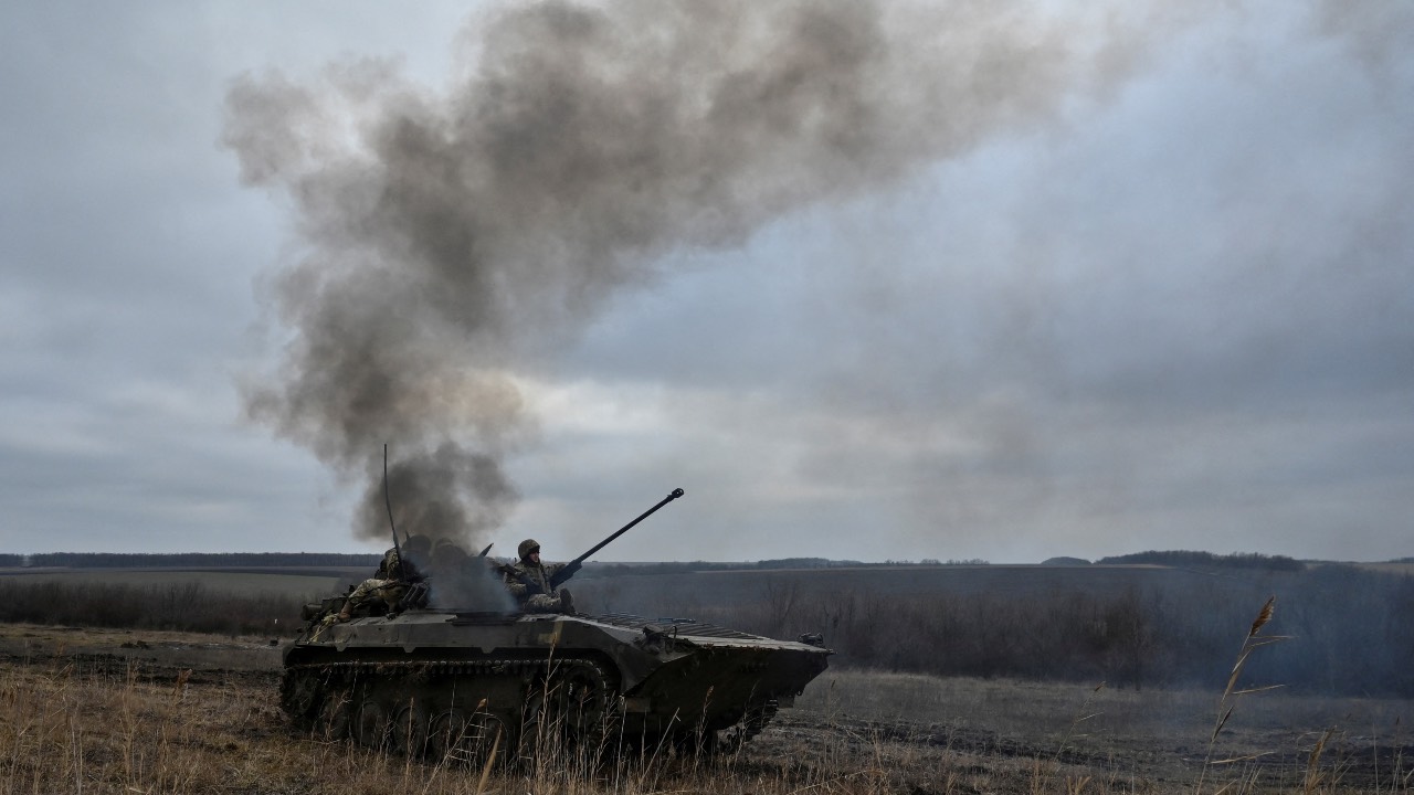 Ukrainian service members ride atop an infantry fighting vehicle during offensive and assault drills, in Zaporizhzhia region. /Stringer/Reuters