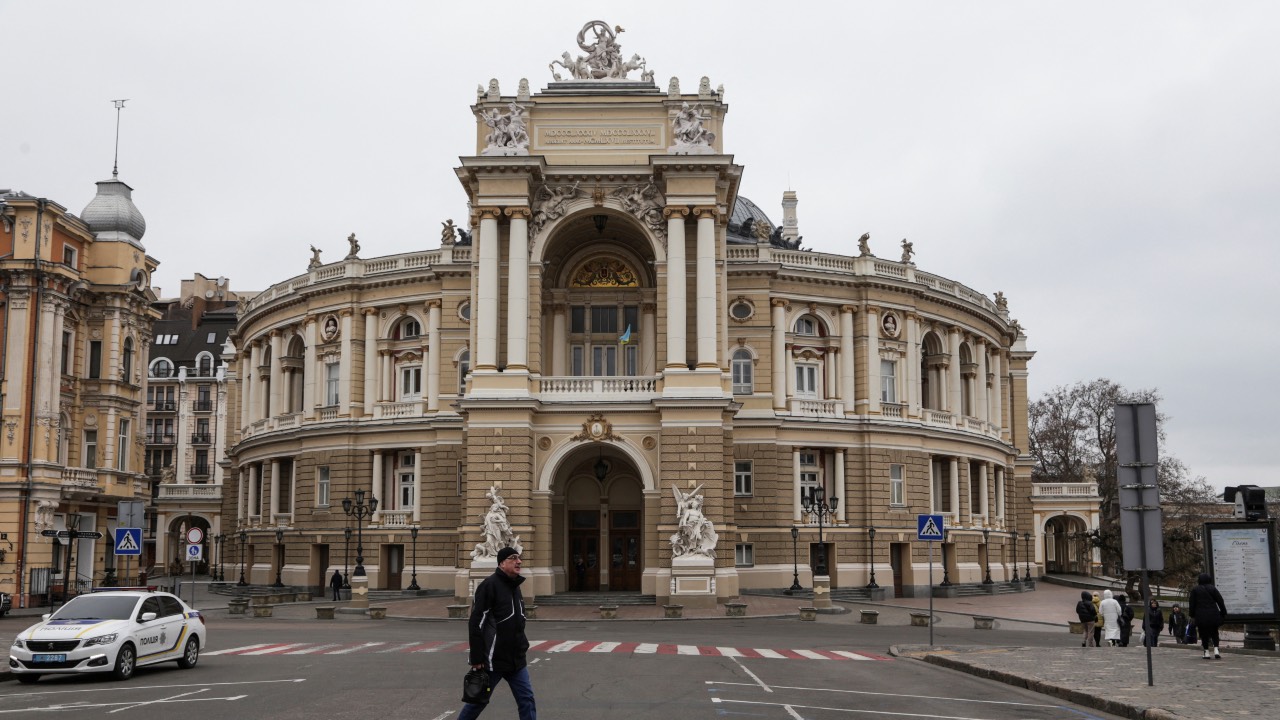 A man walks next to the Opera Theater building in the city centre in Odesa. /Serhii Smolientsev/Reuters