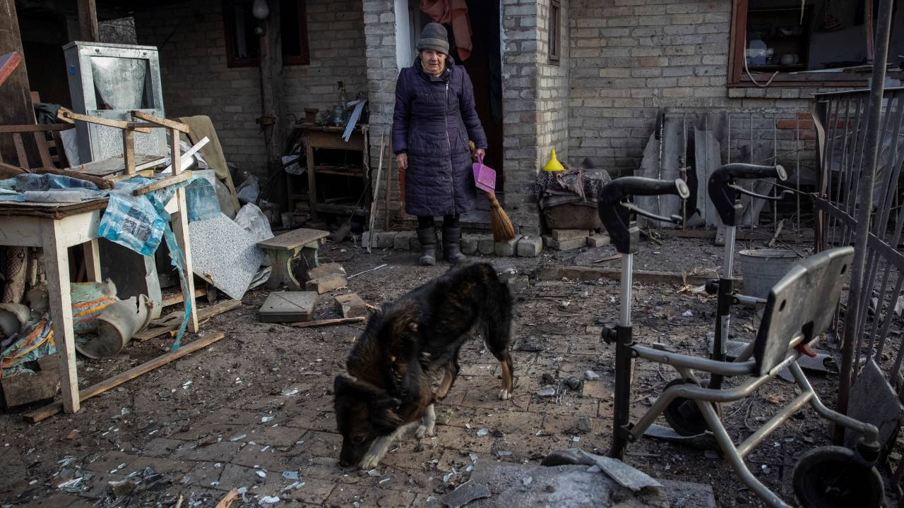 Yevheniia Yepifanova, 83, stands next to her house damaged by a Russian military strike in Donetsk's Chasiv Yar. /Oleksandr Ratushniak/Reuters