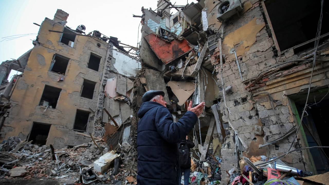 A local stands by an apartment destroyed by a deadly Russian missile strike in Kramatorsk. /Vyacheslav Madiyevskyy/Reuters