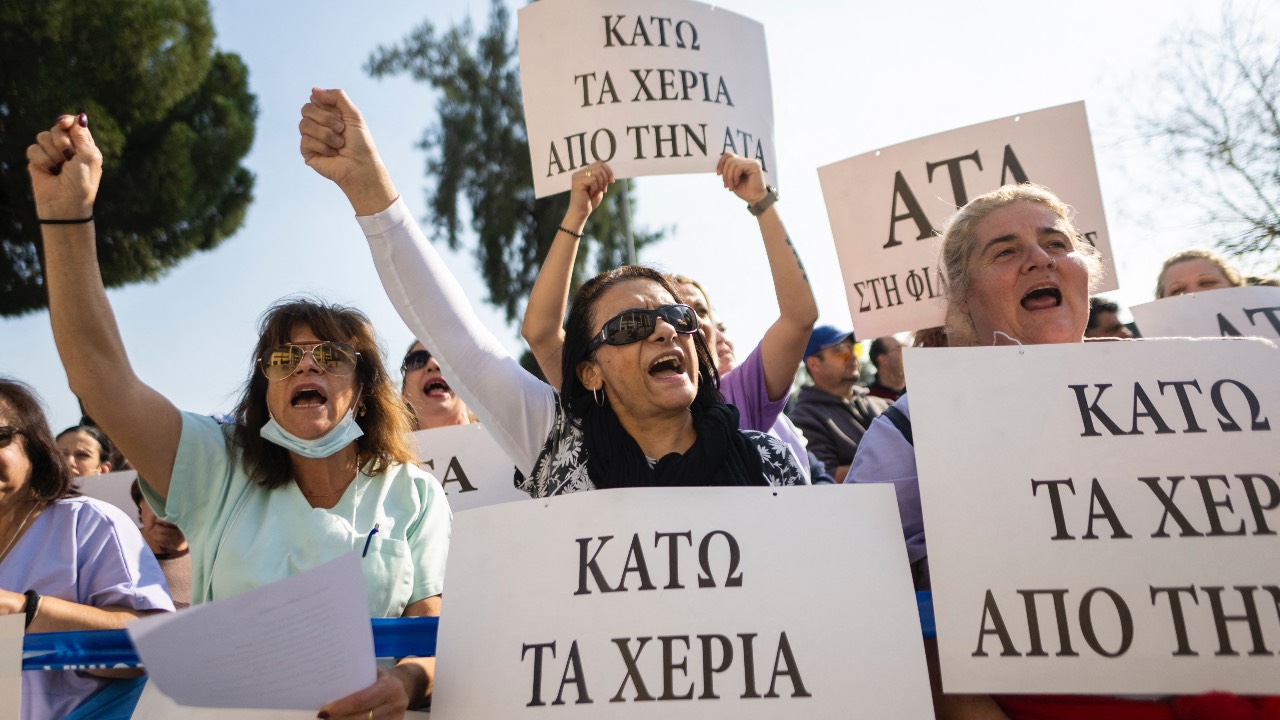 Public and private sector employees protest in front of the Finance Ministry in the Cypriot capital Nicosia during a nationwide general strike demanding the reinstatement of the inflation-linked cost-of-living allowance. /Jewel Samad/AFP