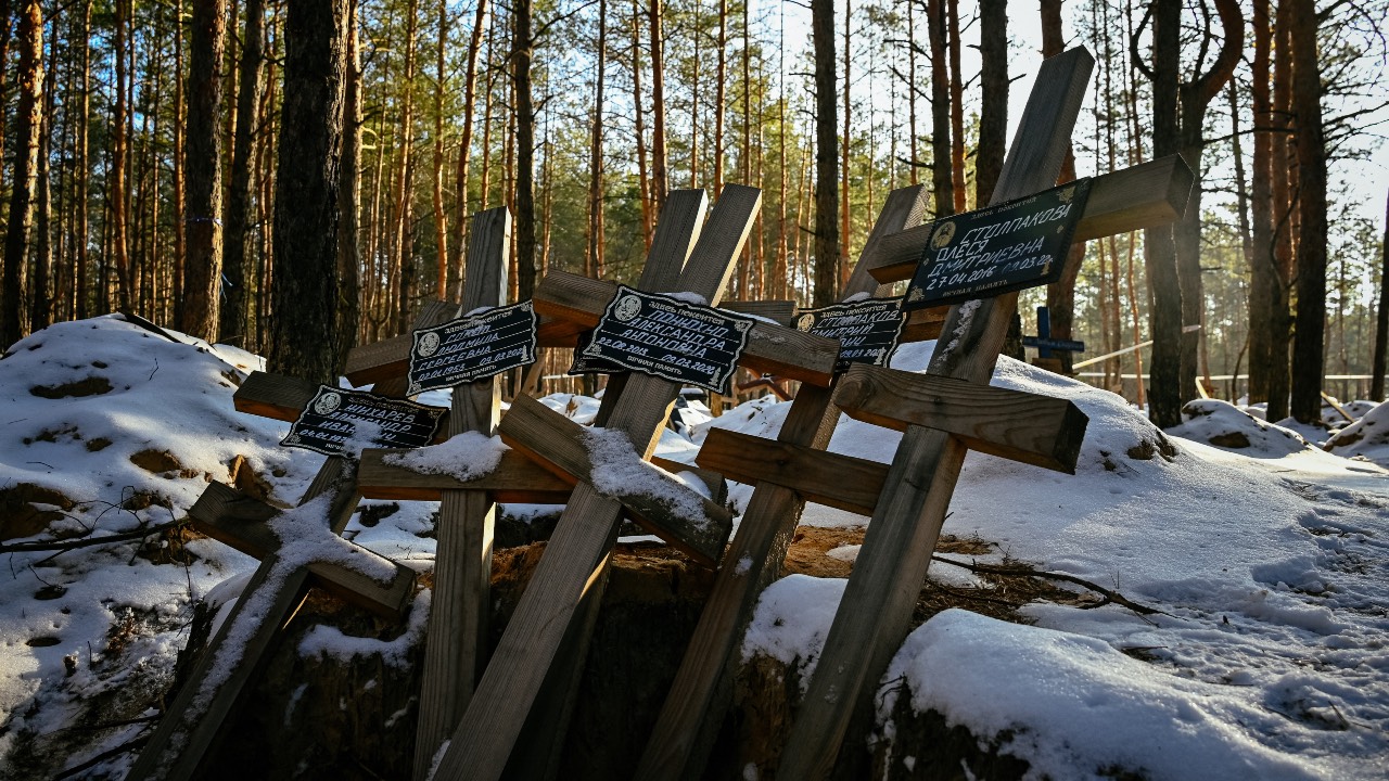 An empty grave in the forest near the town of Izyum, Kharkiv region, where the bodies of 451 dead people were buried during the Russian occupation. /Sergey Bobok/AFP