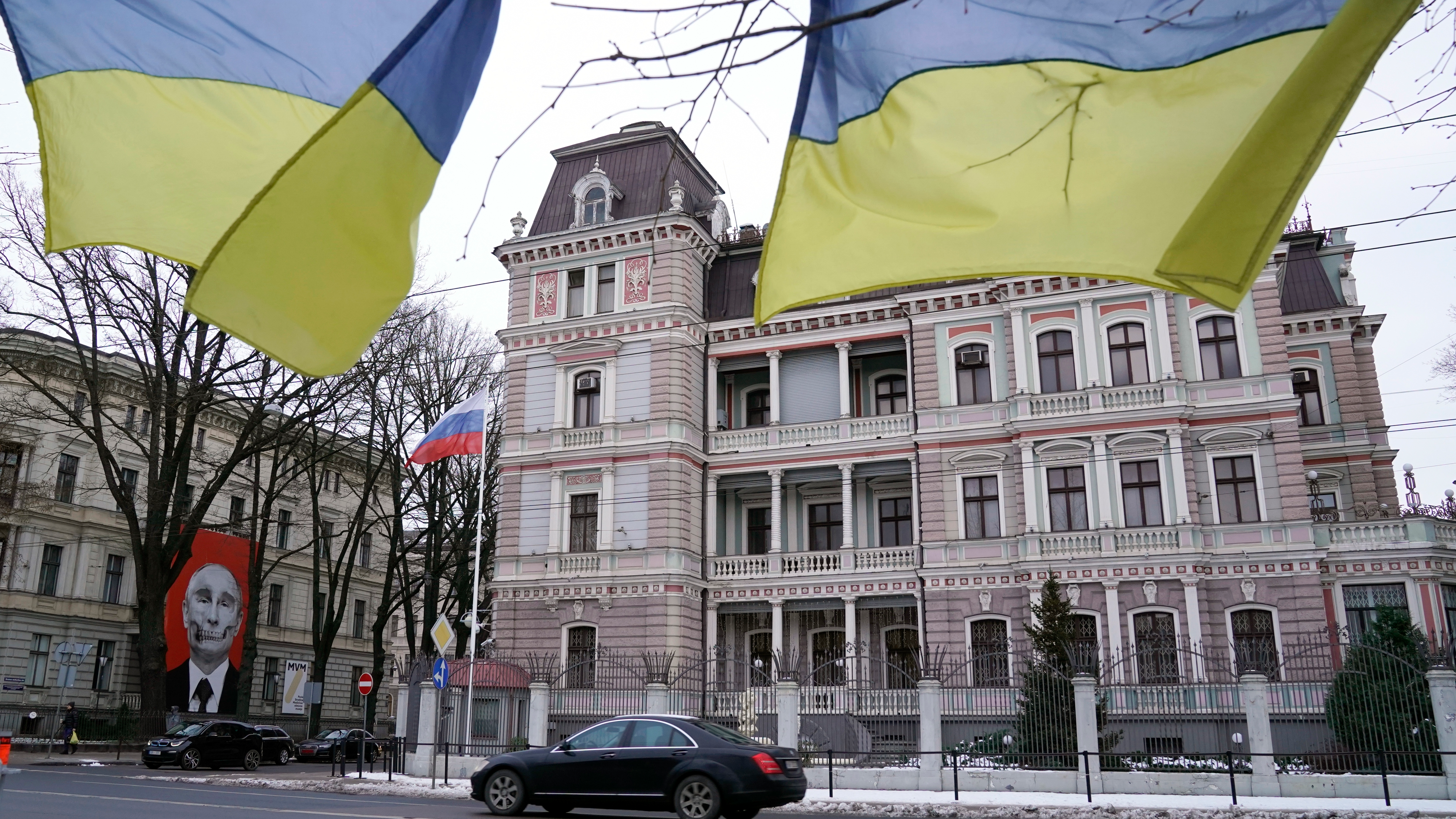 Ukrainian national flags flutter in the wind on the opposite side of the Russian Embassy's building in Riga, Latvia, Tuesday, Jan. 24, 2023. /Roman Koksaro/ AP