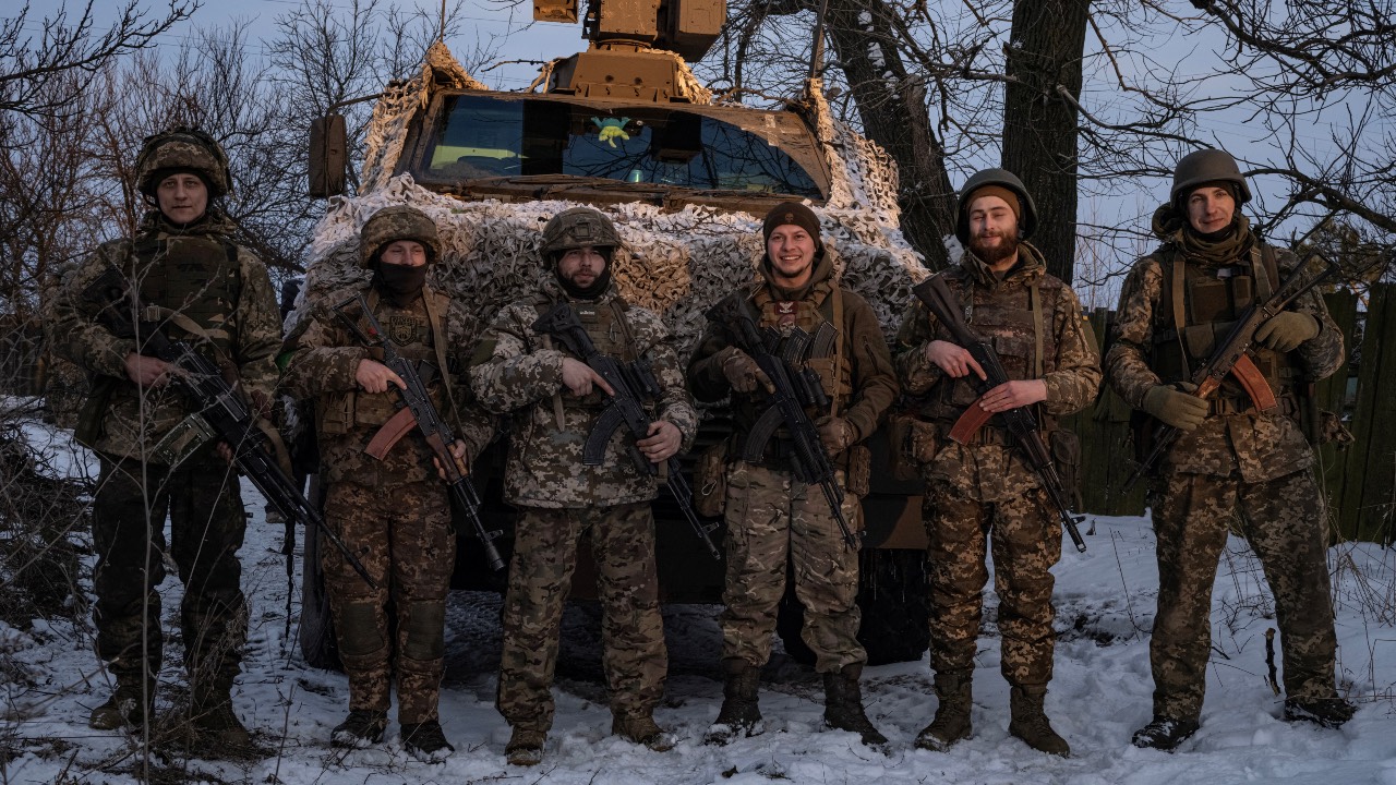 Ukrainian soldiers of the 80th Air Assault Brigade stand in front of a Bushmaster Protected Mobility Vehicle, near Bakhmut, Donetsk region. /Marko Djurica/Reuters