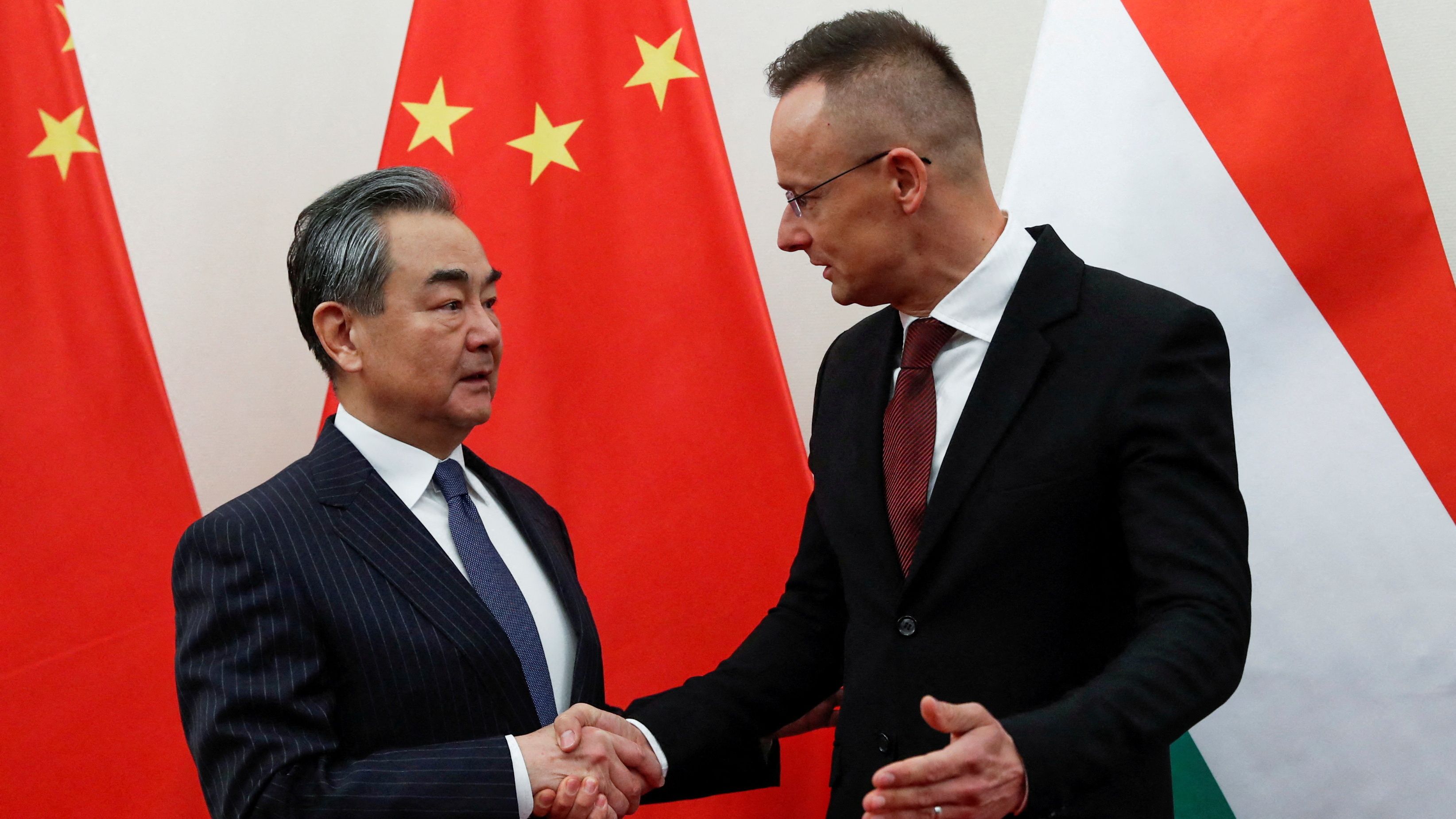Hungary's Foreign Minister Peter Szijjarto (right) thanked China for their investment and support./ Bernadett Szabo/Reuters