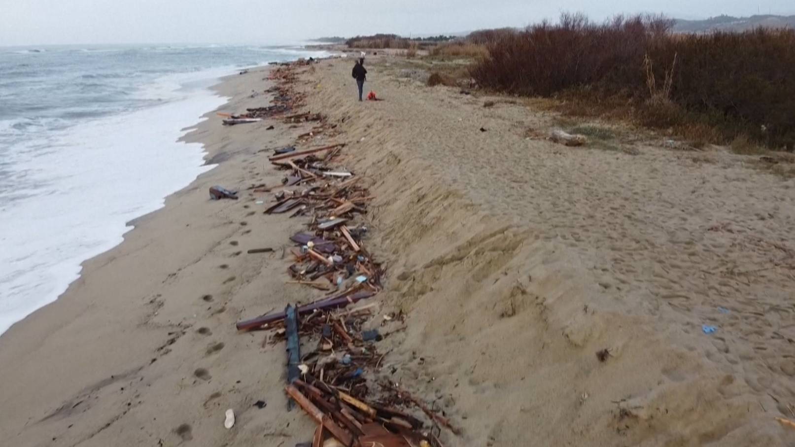 Debris from the sunken wooden boat on the shore in Calabria. /CGTN