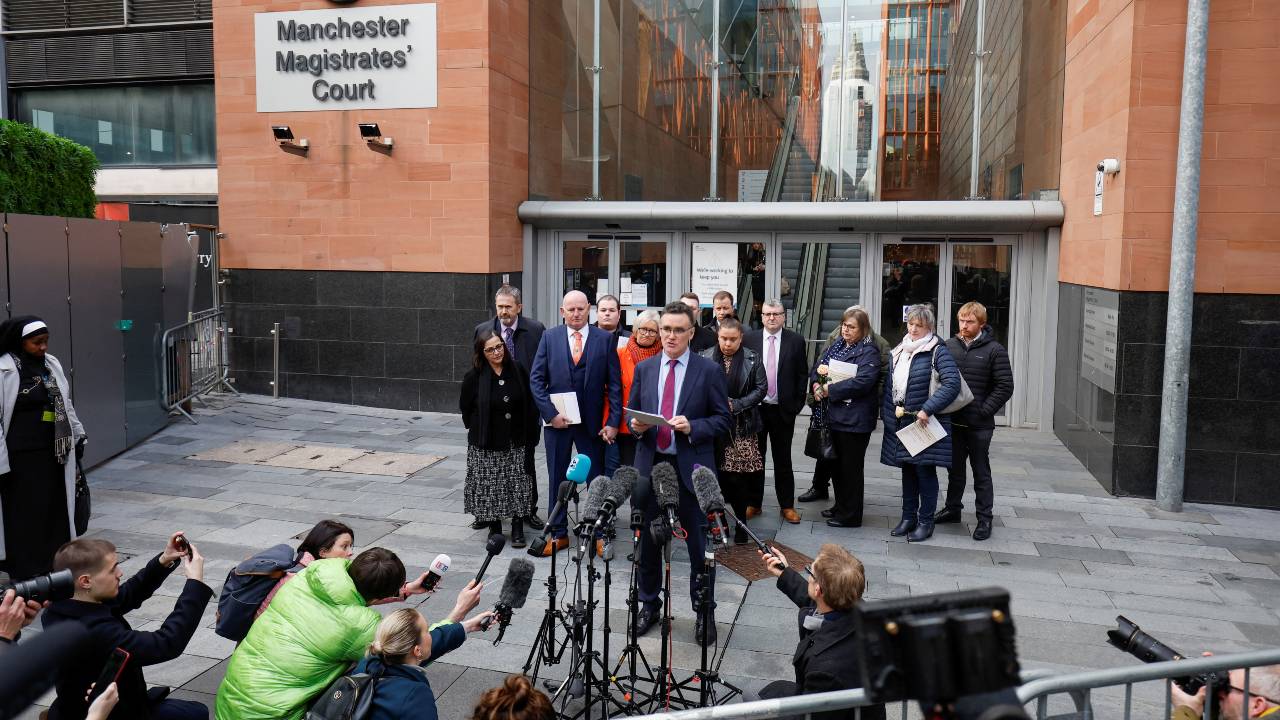 A lawyer representing 11 victims' families reads out a statement reacting to the inquiry findings outside Manchester Magistrates' Court. /Jason Cairnduff/Reuters