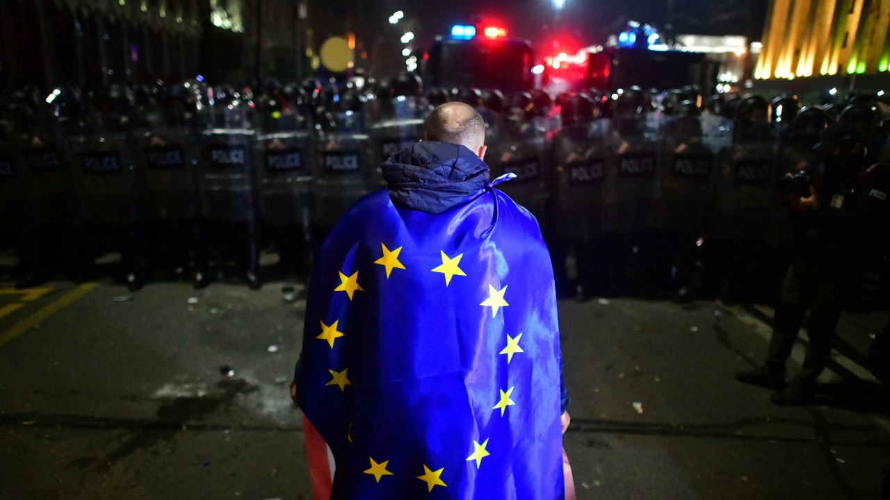 A demonstrator wears a European Union flag during the Tblisi protests. /Zurab Javakhadze/Reuters