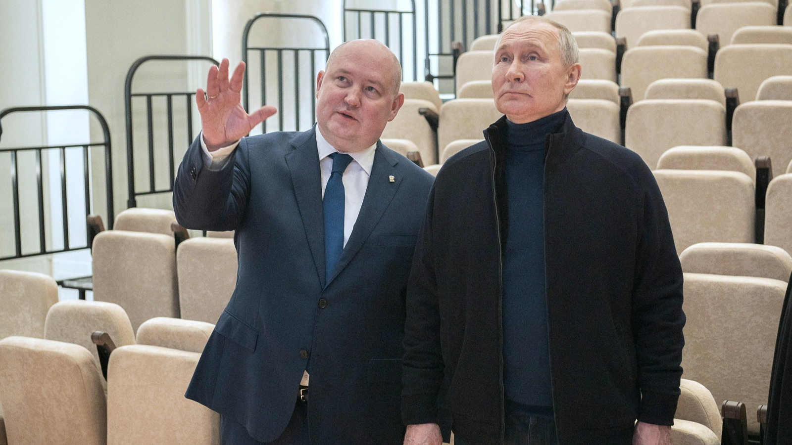 Russian President Vladimir Putin and Governor of Sevastopol Mikhail Razvozhayev visit a children's arts and aesthetic center. /Reuters via third party