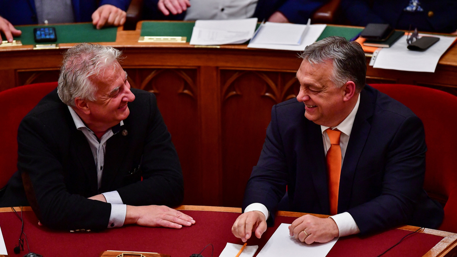 Hungarian Prime Minister Viktor Orban and Deputy Prime Minister Zsolt Semjen smile after voting in favour of the ratification of Finland's NATO membership in Budapest./Reuters/Marton Monus.