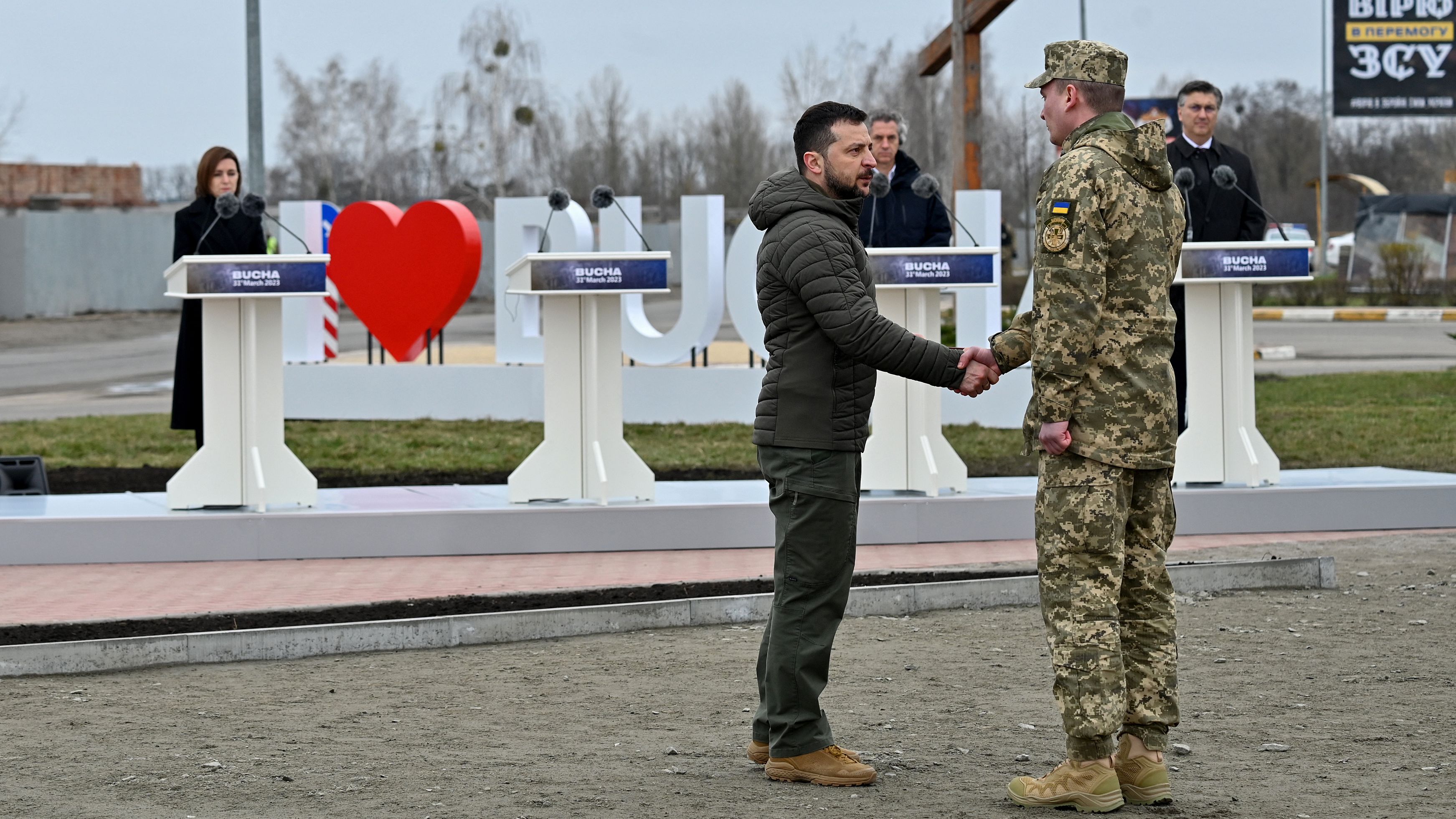 Ukraine President Volodymyr Zelenskyy visited Bucha for a ceremony marking the first anniversary of the Russian retreat./ Sergei Supinsky/AFP