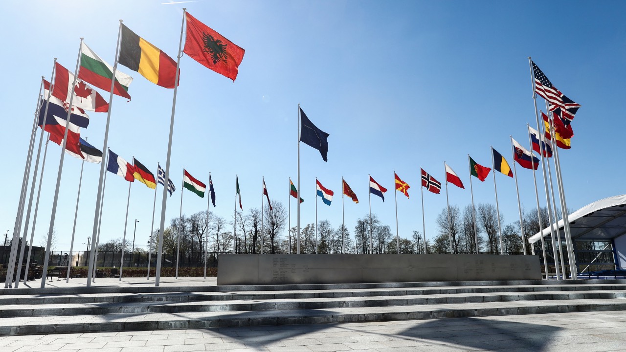 The national flags of countries member of the NATO fly outside the organization headquarters in Brussels. /Kenzo Tribouillard /AFP