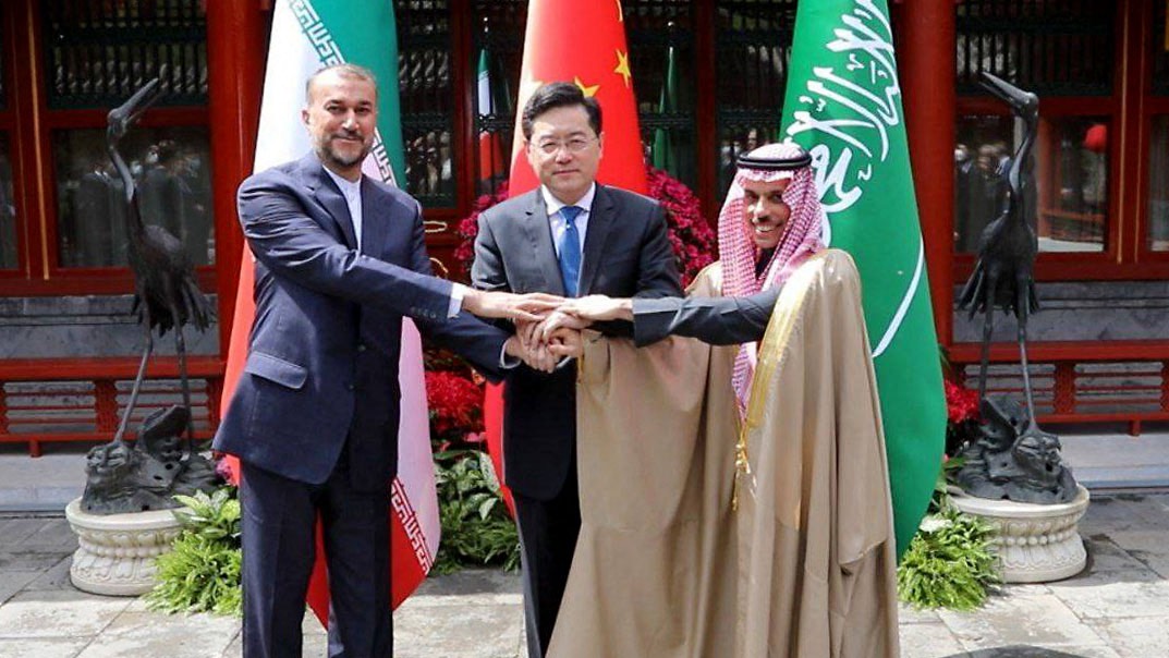 Iran's Foreign Minister Hossein Amir-Abdollahian (L) shaking hands with Saudi Foreign Affairs Minister Prince Faisal bin Farhan and Chinese Foreign Minister Qin Gang (C) during a meeting in Beijing. /Iranian Foreign Ministry/AFP