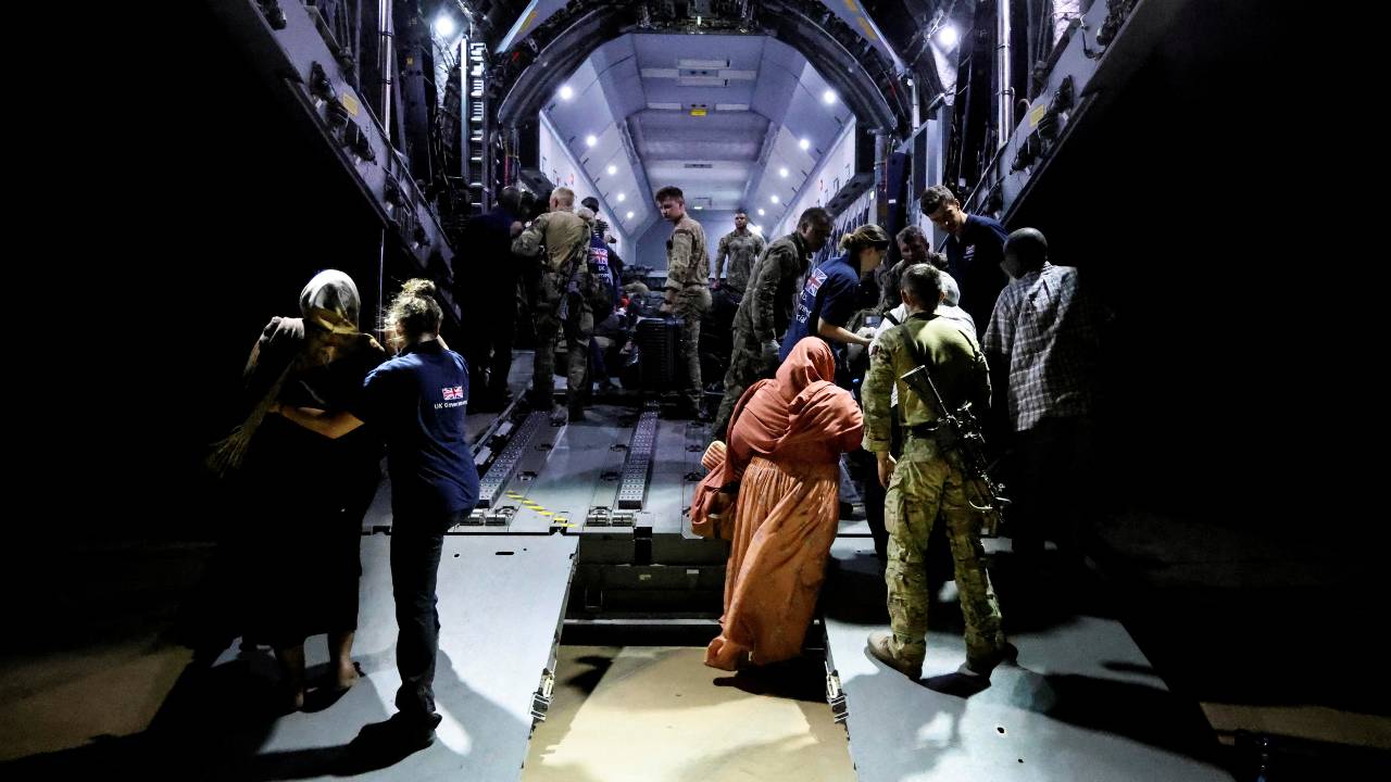 British nationals board an RAF aircraft during the evacuation from Sudan to Cyprus. /Arron Hoare/UK MOD/Reuters