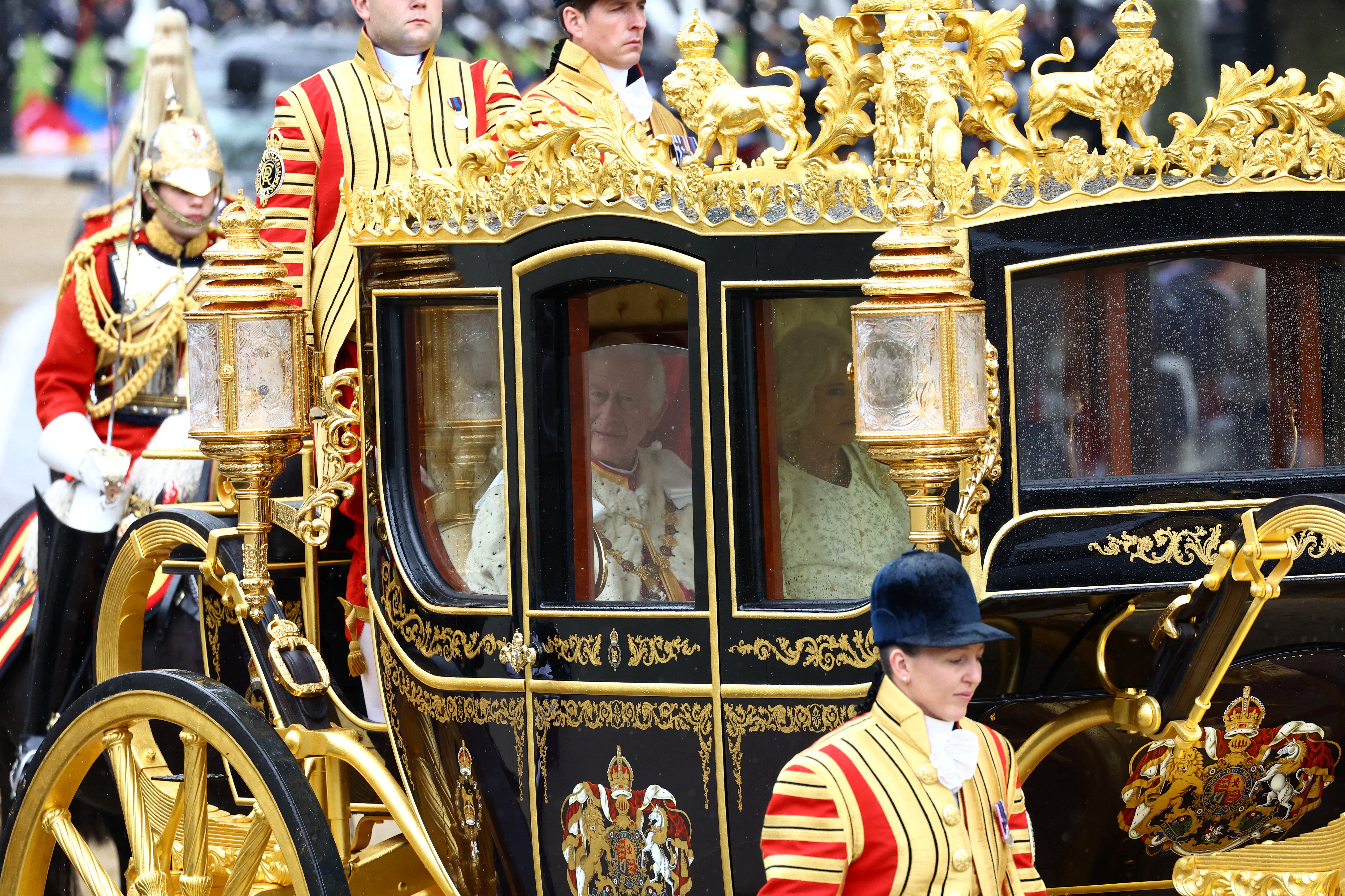 Charles in the Diamond Jubilee State Coach traveling to Westminster Abbey. Lisi Niesner / Reuters