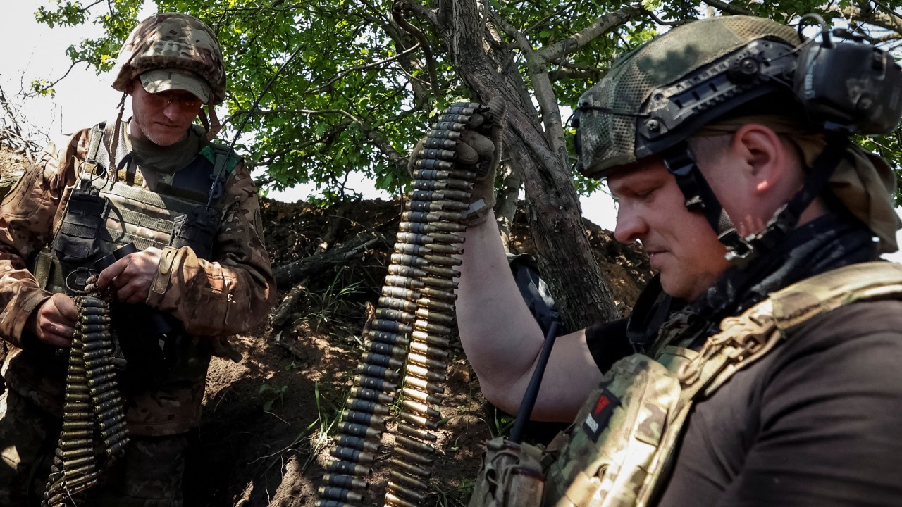 Ukrainian soldiers load ammunition for a machine gun at their position at a frontline in Donetsk region. /Ukraine Radio Free Europe/Radio Liberty/Serhii Nuzhnenko/Reuters
