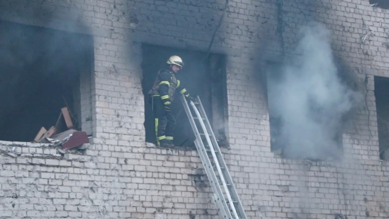 A firefighter at a fire depot destroyed by a Russian missile strike in Dnipro. /Press service of the State Emergency Service of Ukraine in Dnipropetrovsk region/Handout via Reuters