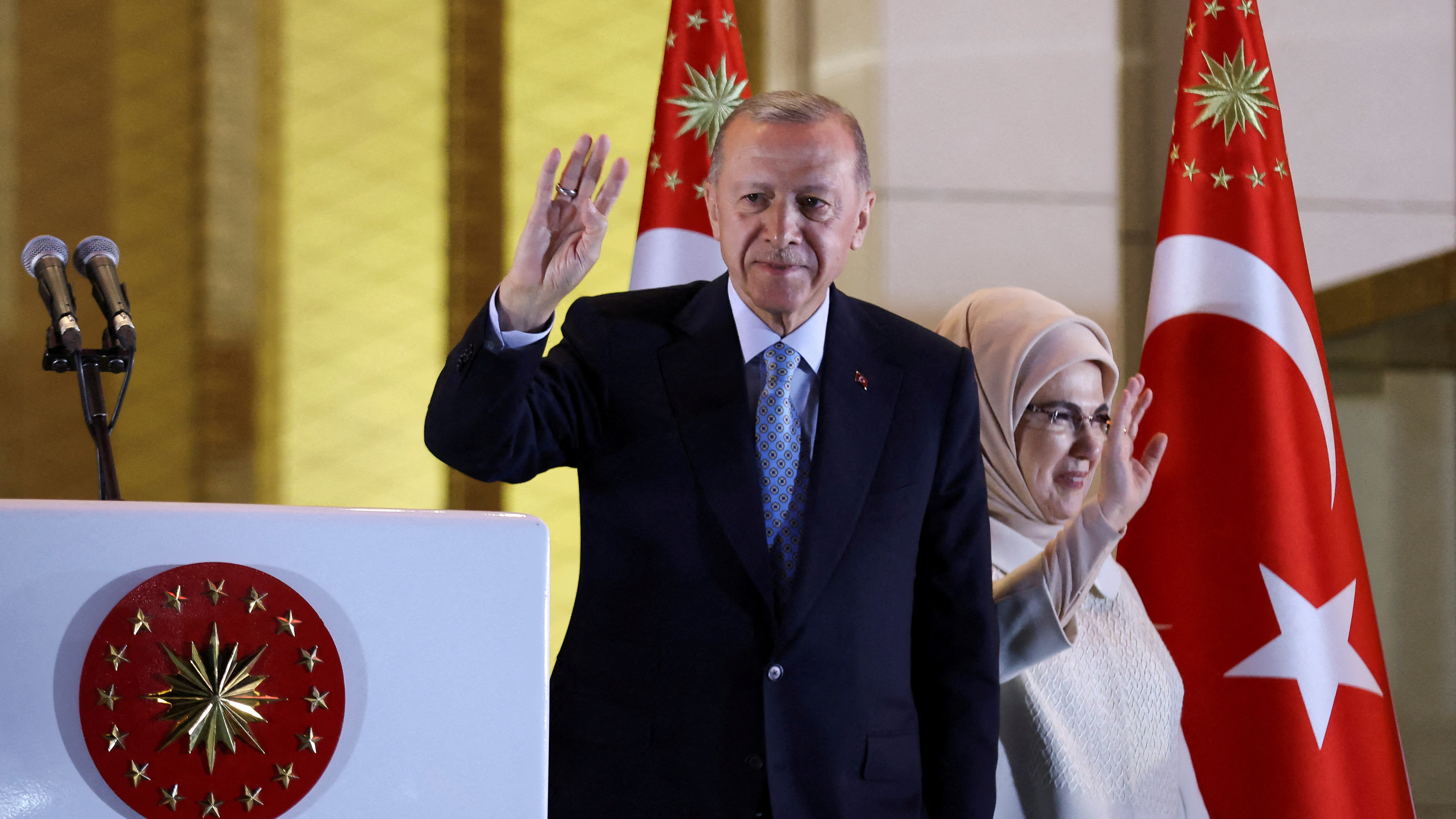 Turkish President Tayyip Erdogan and his wife Ermine Erdogan wave as he addresses his supporters following his victory. Umit Bektas / Reuters