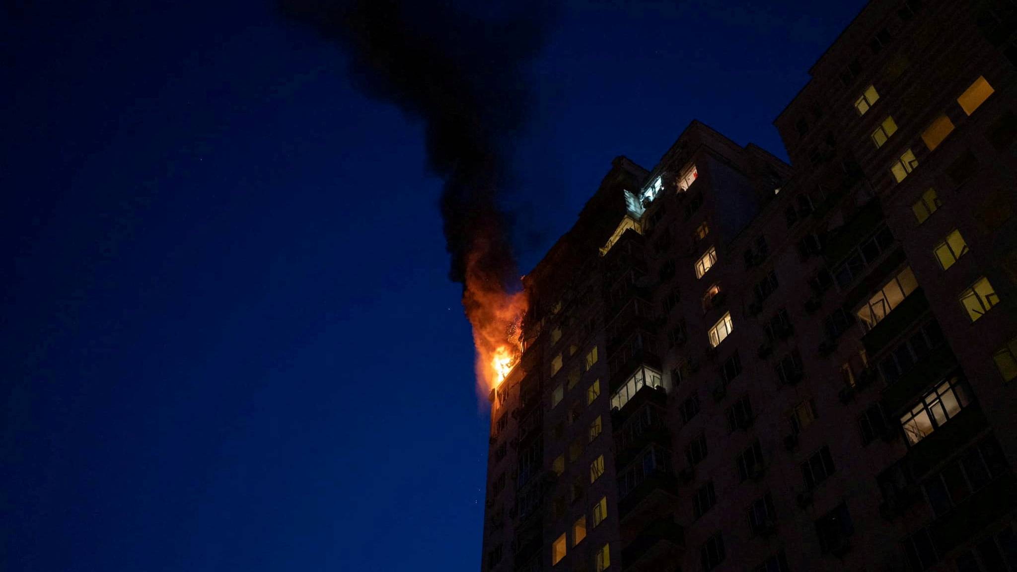 An apartment building burns after being damaged during a massive Russian drone strike in Kyiv. Pablo Petrov/Press service of the State Emergency Service of Ukraine/Reuters